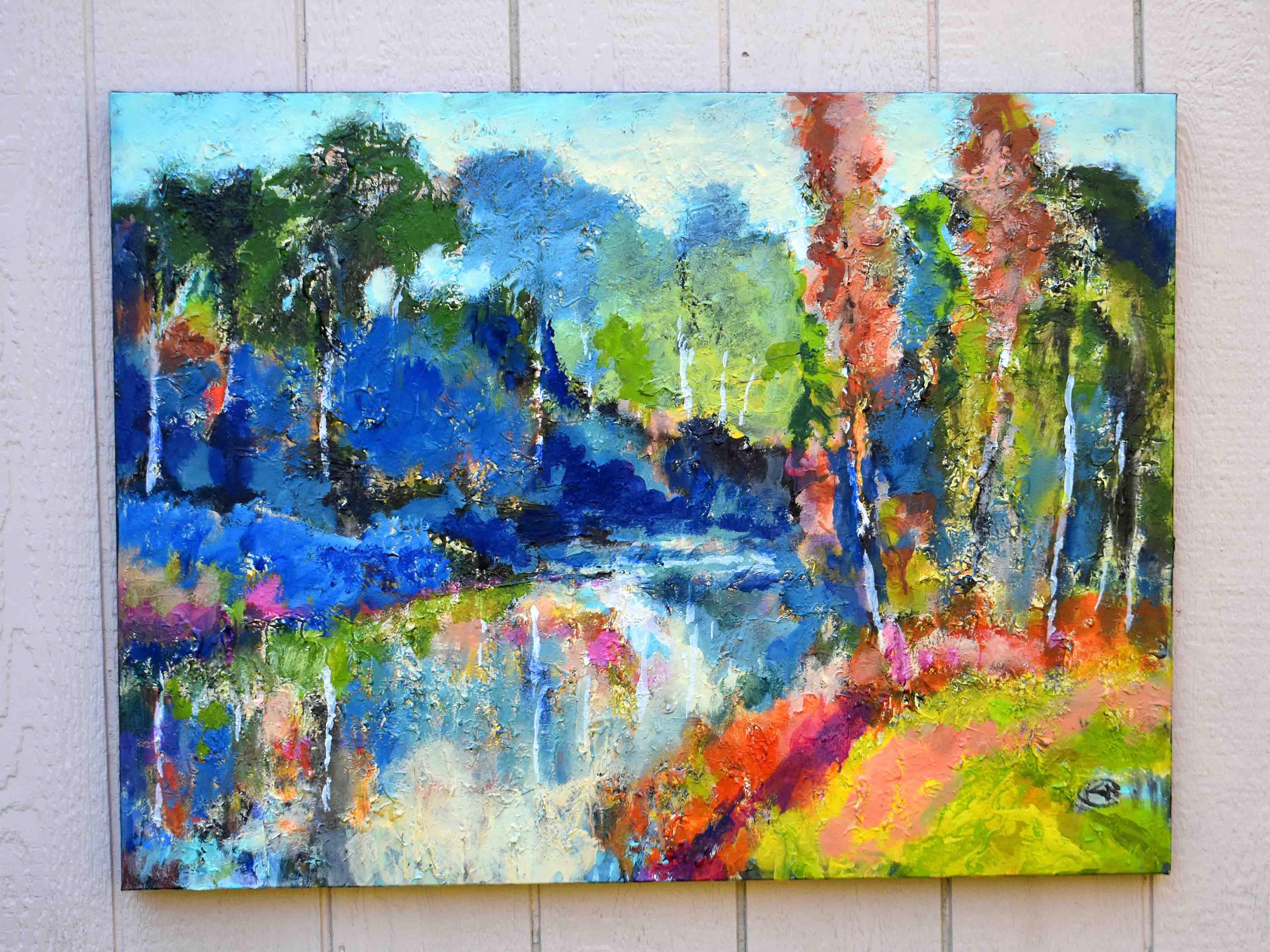 <p>Artist Comments<br>Slow-moving water winds through a vibrant landscape surrounded by colorful trees. Thick textures and layered brushstrokes create movement and depth across the scene. Bright blues and greens bring the piece to