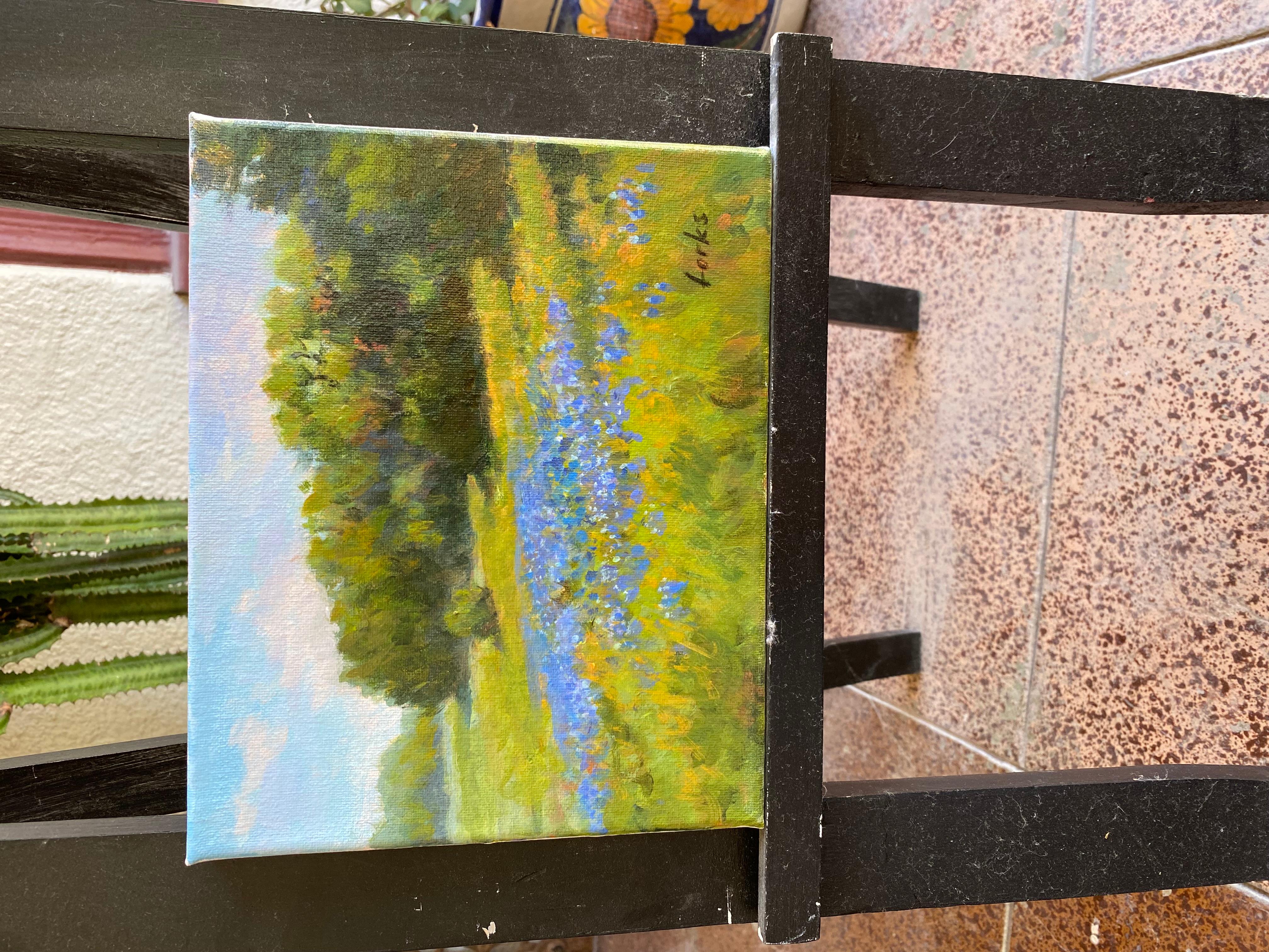 <p>Artist Comments<br>Bluebonnets bloom in a tranquil Texan meadow beneath a soft, sunny sky. Vibrant shades of green and blue fill the foreground, bringing the wildflowers to life. In the background, dense clusters of trees create a lush, calming