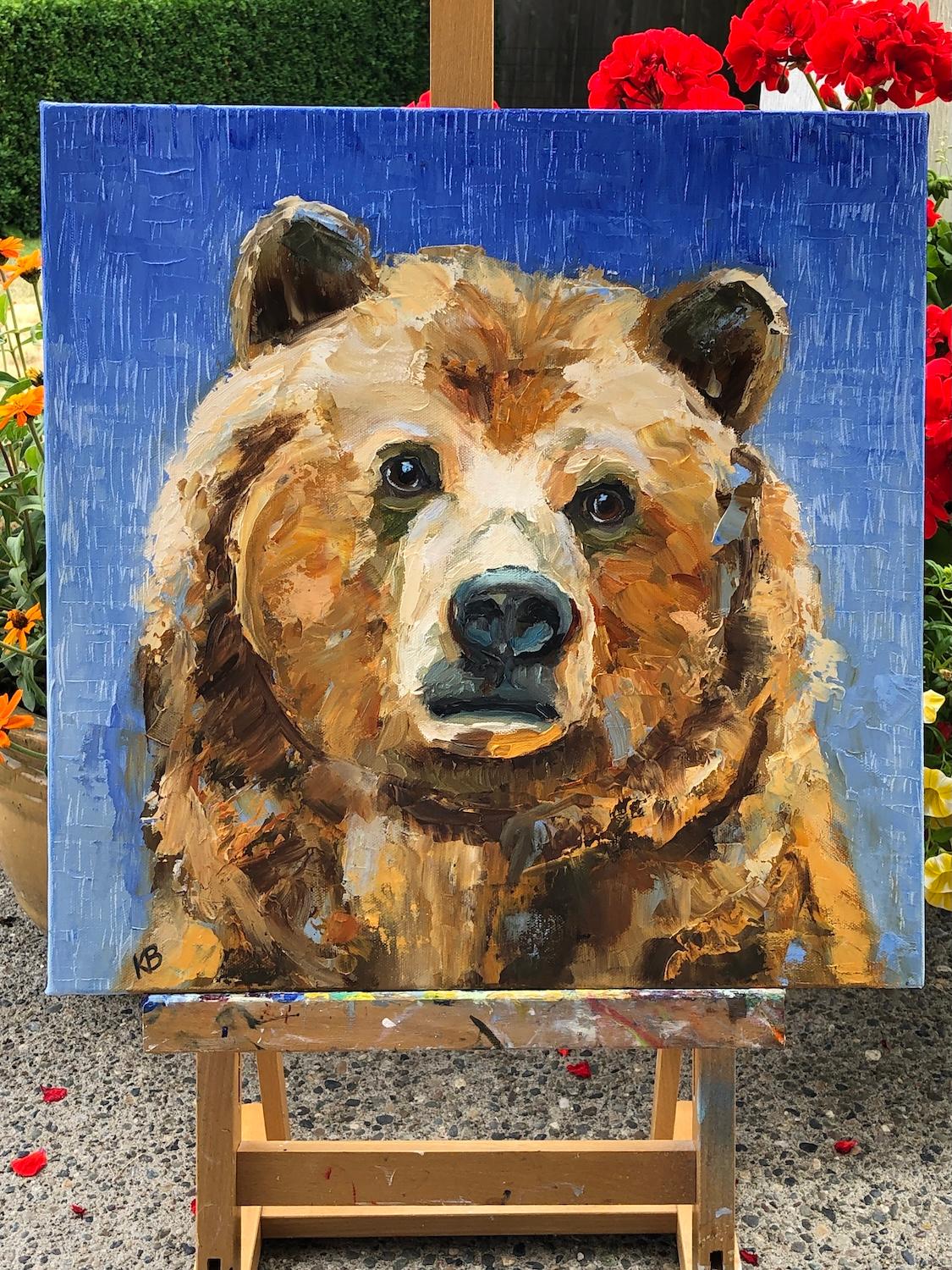 <p>Artist Comments<br>A grizzly bear exudes a quiet strength against a soft blue background. Artist Karen Barton used both palette knife and brush to build texture and depth. The result is a richly layered portrait that feels both powerful and
