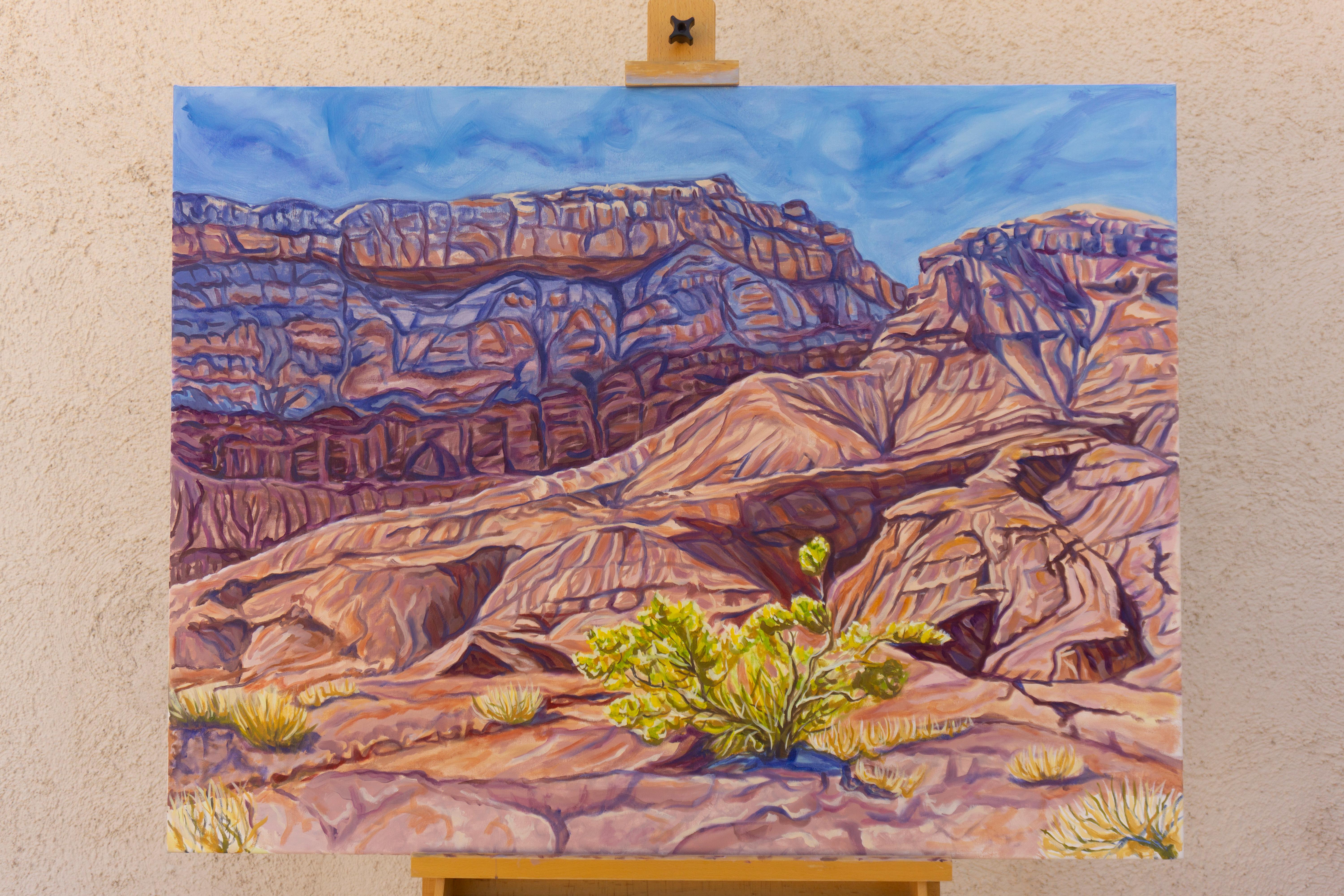 <p>Artist Comments<br>A small green bush stands out as a symbol of life against an eroded desert. The bright sun reveals the ruggedness of the badlands. A darker mesa rises in the distance, its blue and deep red shades capture both the cool tones of
