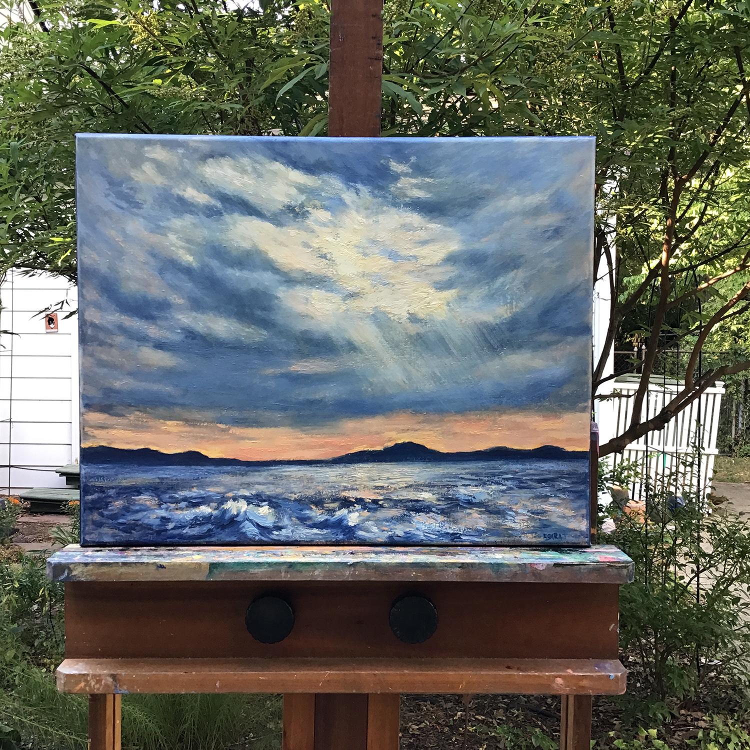 <p>Commentaires de l'artiste<br>Ce paysage marin capture un moment fugace à Mandalay Beach, où le jour cède la place à la beauté du crépuscule. Un éclat de lumière traverse les nuages, illuminant un ciel spectaculaire. À l'horizon, les îles