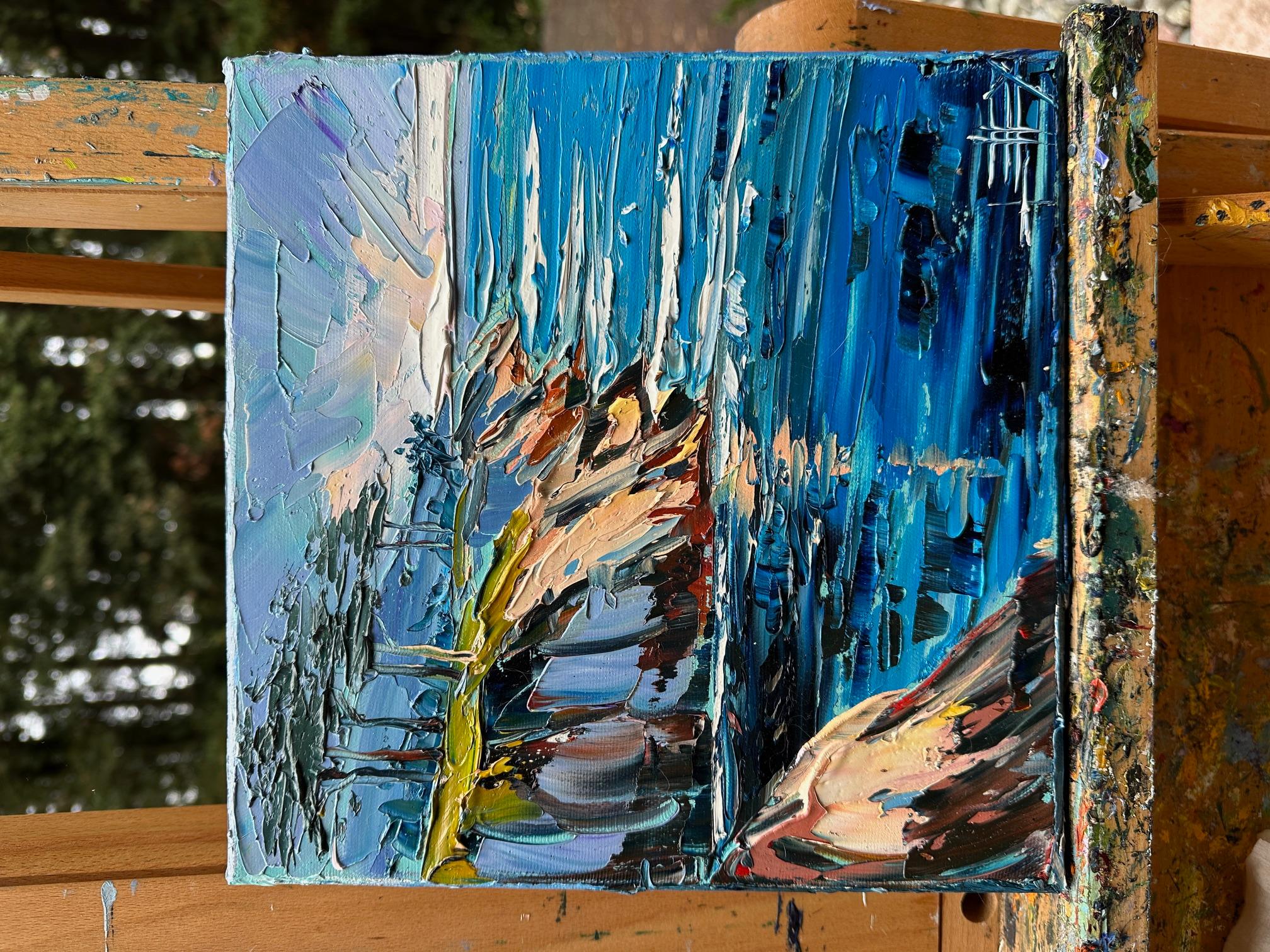 <p>Artist Comments<br>Artist Lisa Elley captures the azure coast of Carmel, California, in this textured palette knife painting. Sunlight shimmers across the blue water, while rugged cliffs with trees catch the glow. Thick impasto and layered