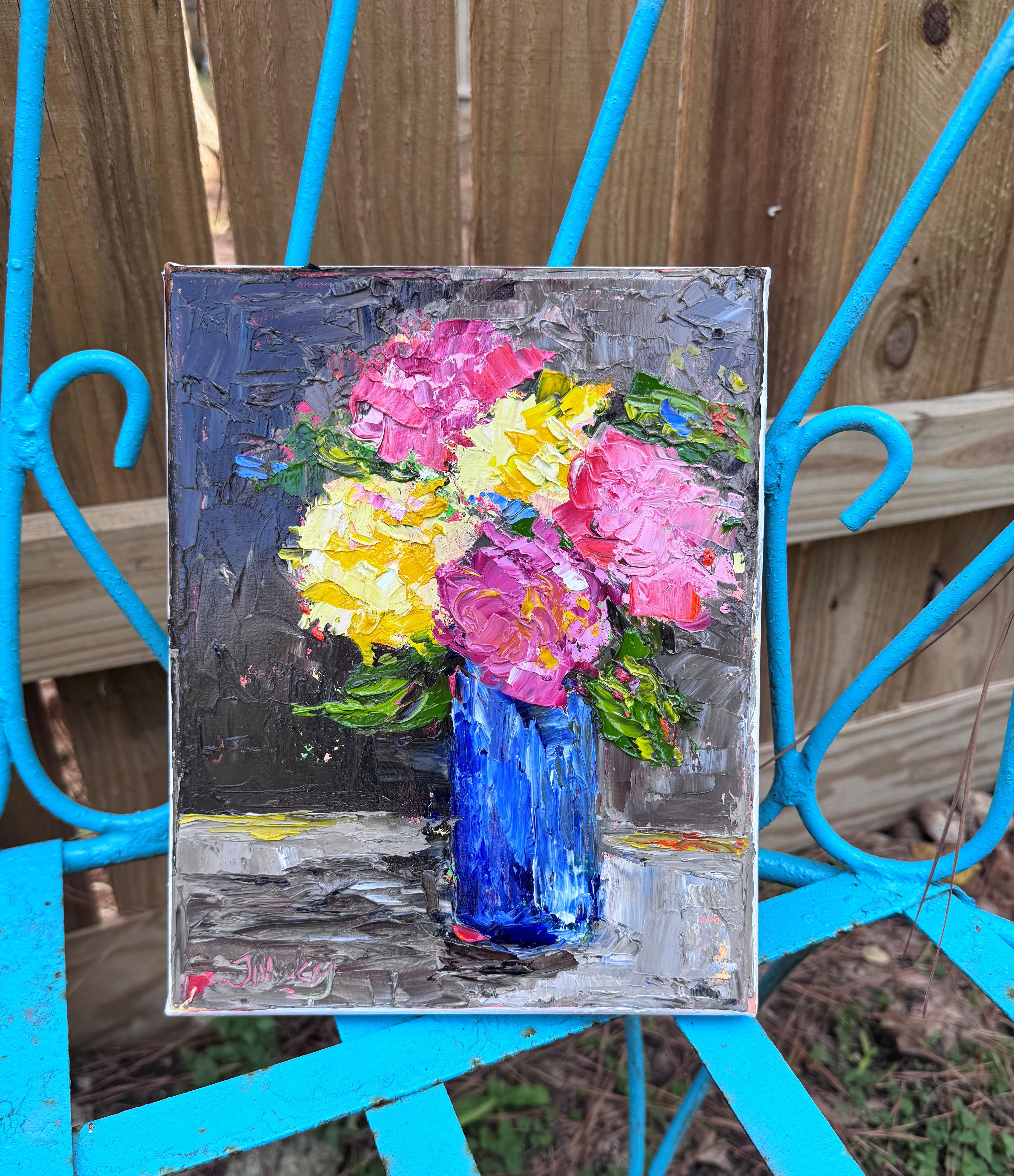 <p>Artist Comments<br>Pink peonies and yellow roses fill a blue vase in this impressionist still life painting. Their vibrant petals contrast with the grey background. Painted alla prima with a palette knife, the composition reveals bold texture and