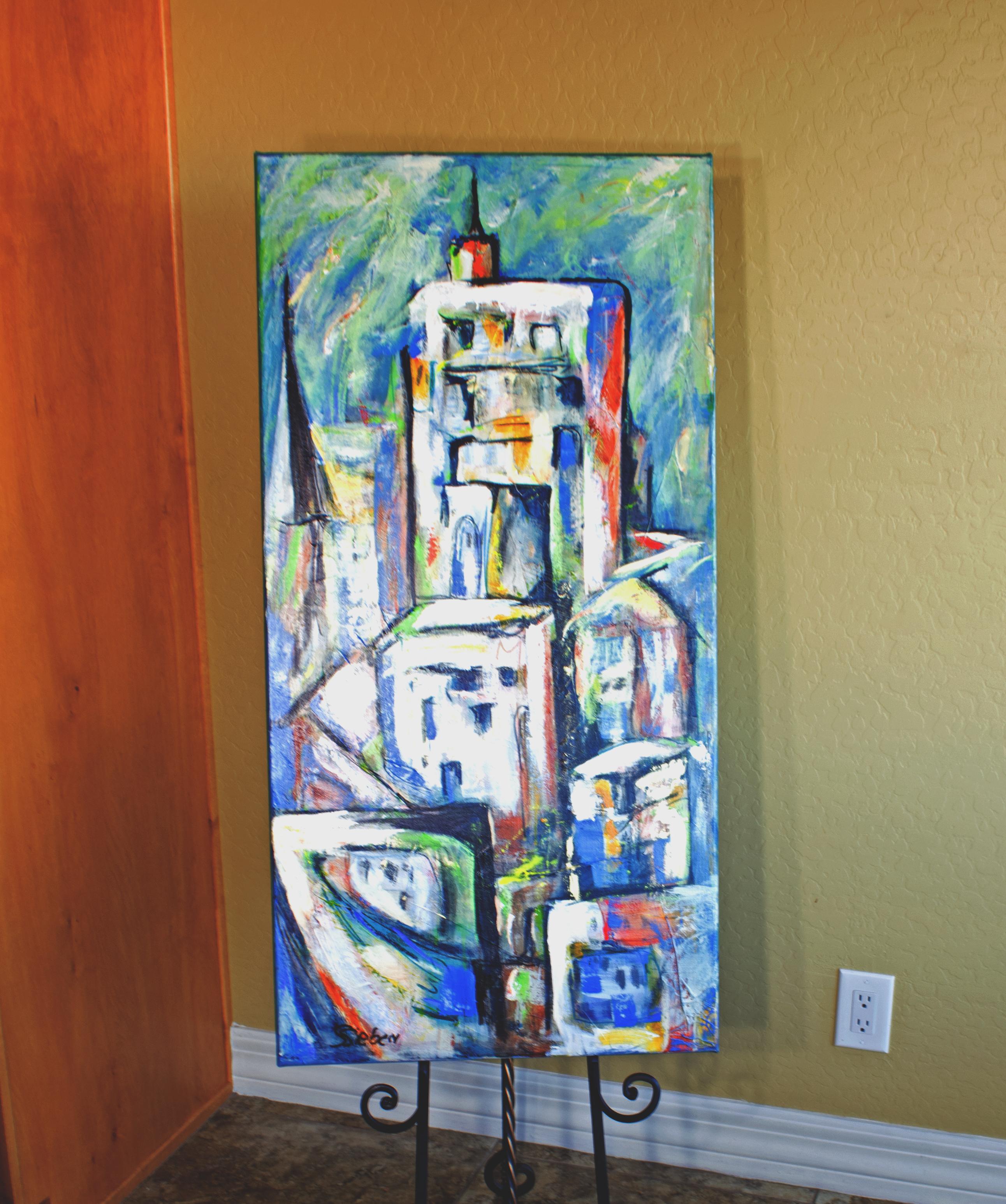 <p>Artist Comments<br>Colorful buildings and lights create an expressive gathering of city skyscrapers.</p><br/><p>About the Artist<br>Sharon Sieben prefers working in a loose, fluid technique and finds inspiration in the most unexpected things. Her