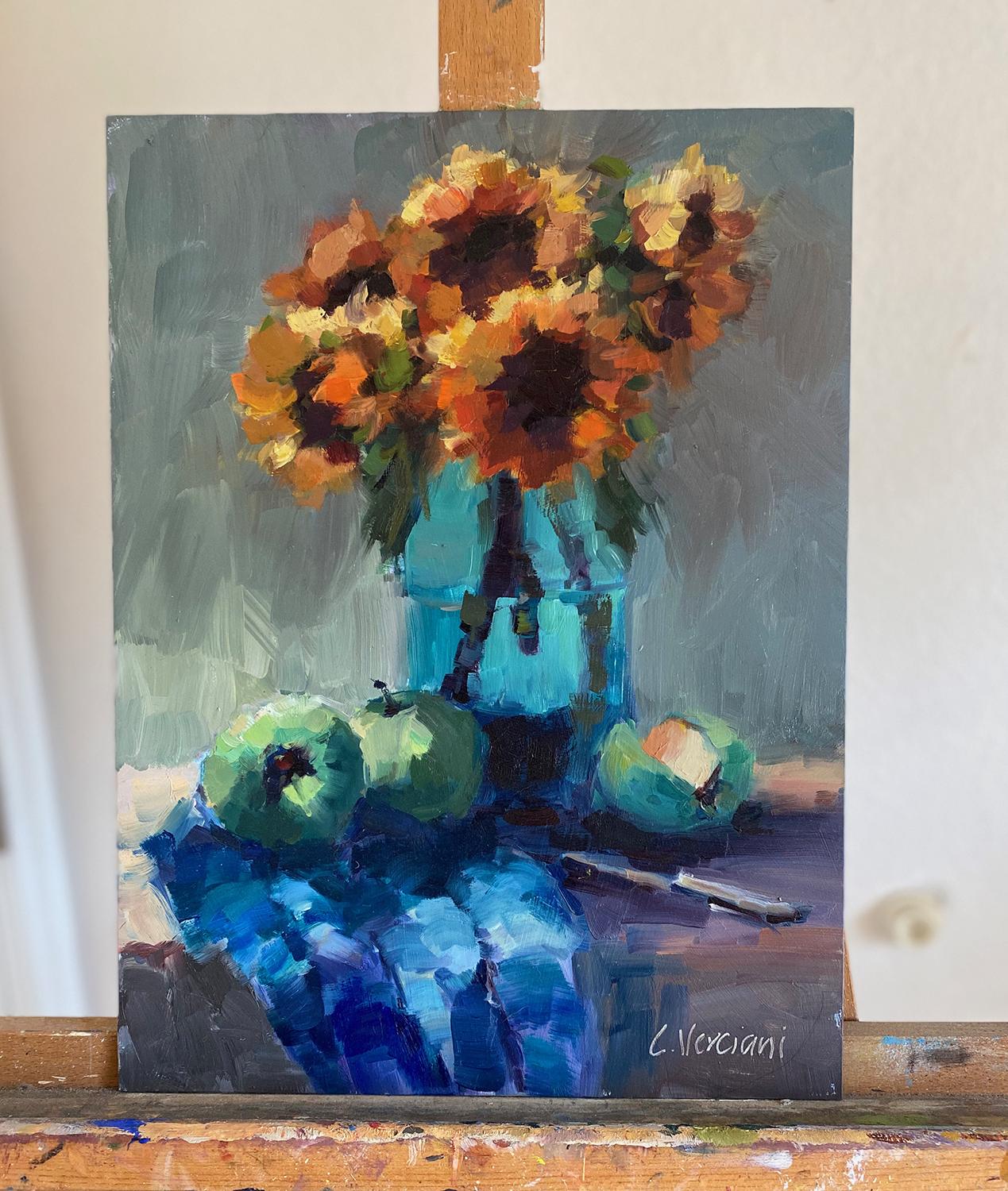 <p>Kommentar des Künstlers<br />Ein impressionistisches Stillleben mit Sonnenblumen und Äpfeln auf einer Tischplatte. Die Künstlerin Claudia Verciani konzentrierte sich auf die verblüffenden Kontraste in diesem klassischen Arrangement. Der Blick