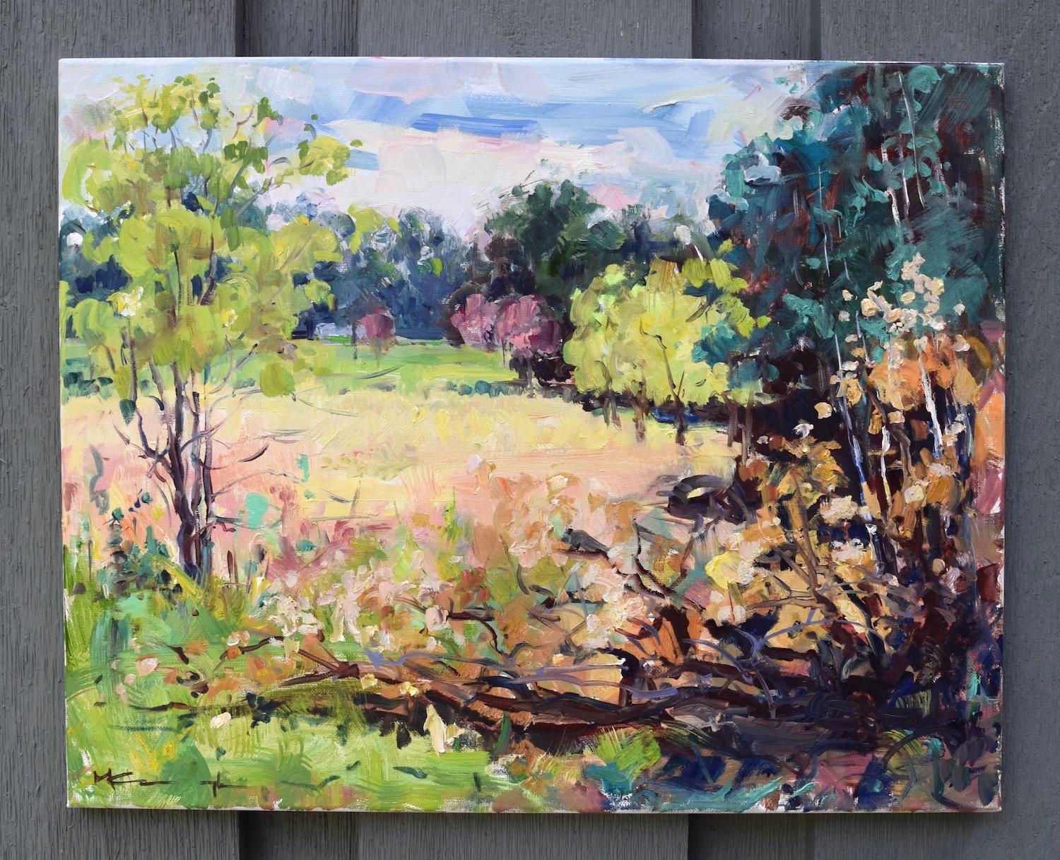<p>Artist Comments<br>An impressionist landscape of lush trees and open fields under a bright blue sky. Artist Mickey Cunningham paints the many greens of summer offset by an ochre field of tall grasses with a dark fallen tree in the foreground.