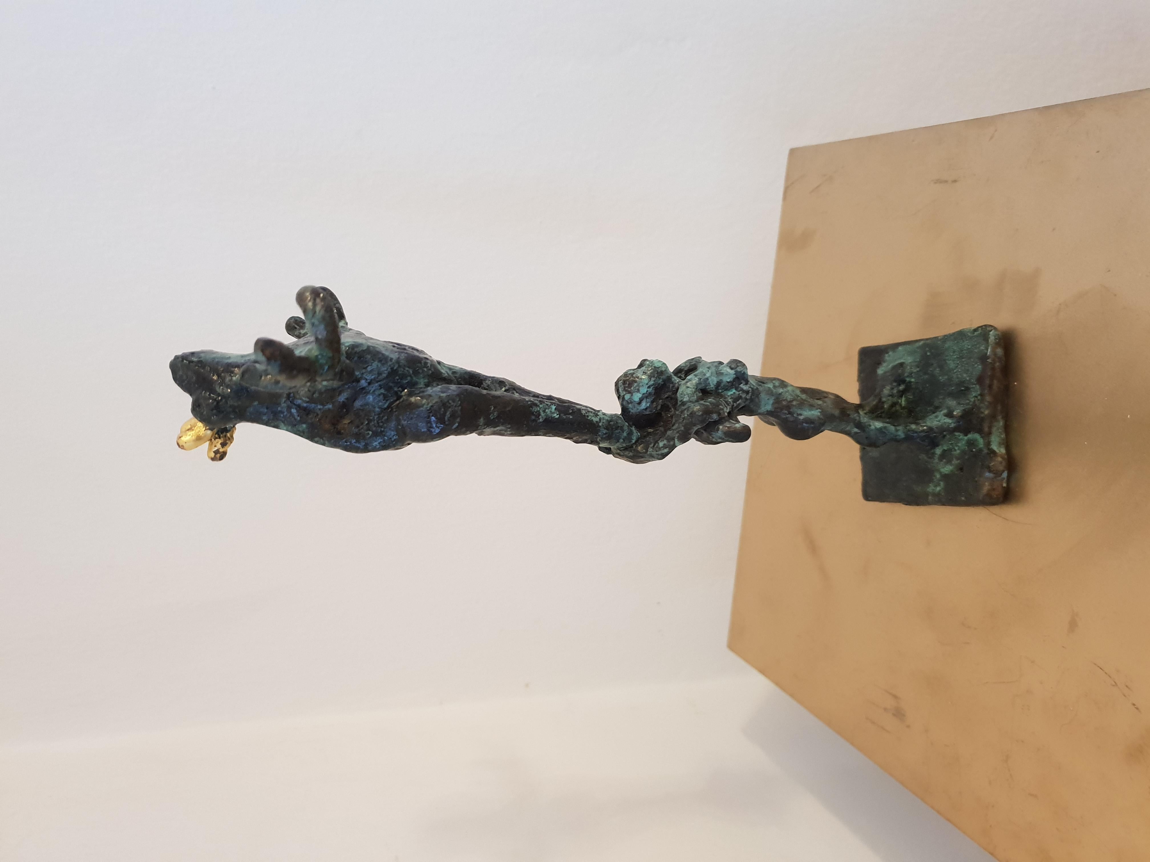 Frog Acrobatics by Helle Crawford, Bronze sculpture of a frog carried by a woman 1