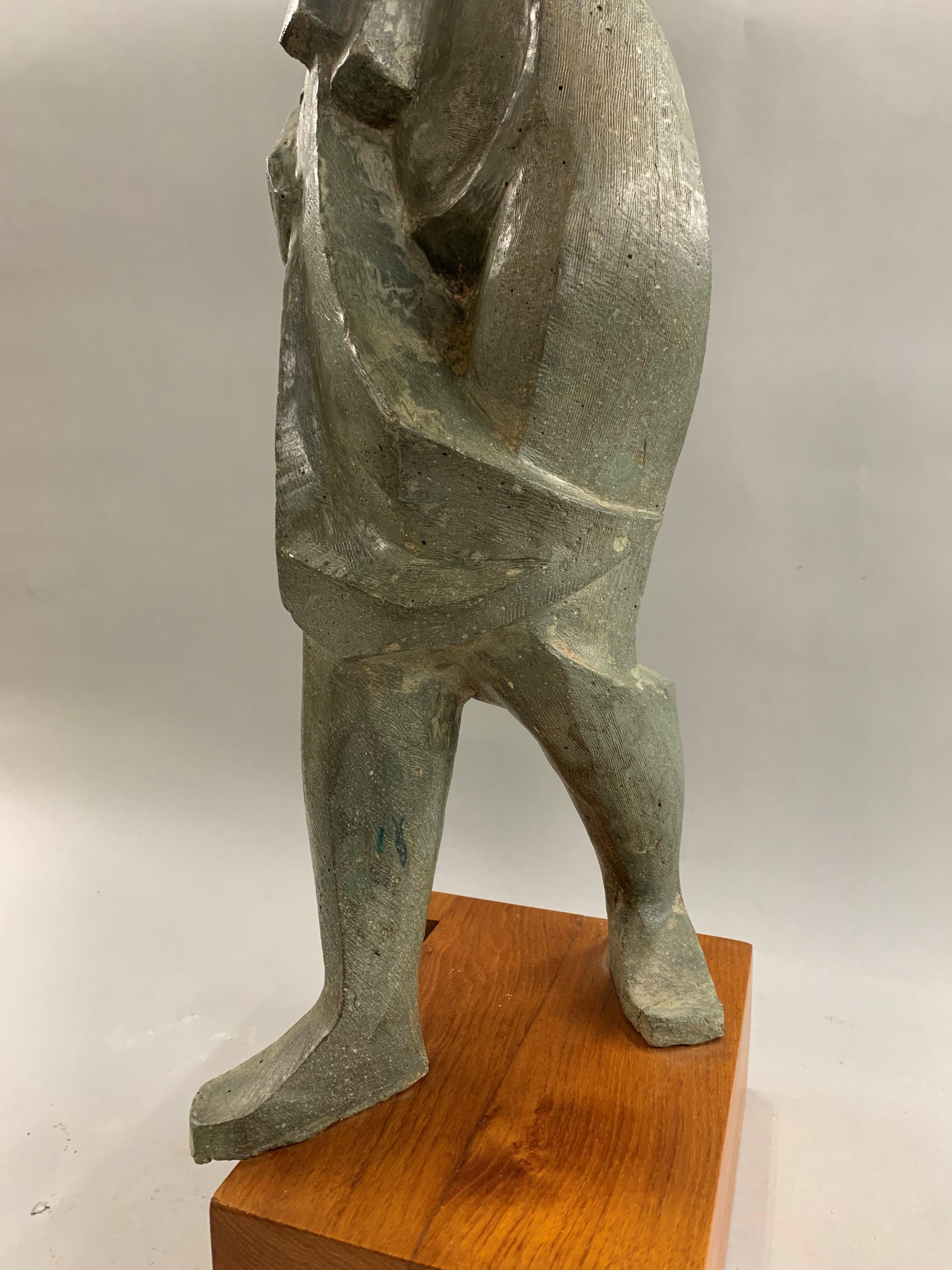This impressionist sculpture of a woman walking was done by New Hampshire artist Robert Hughes (1915-2004). Hughes was born in Providence, Rhode Island and later moved to Berlin, New Hampshire, where he became well known as teacher for 43 years in