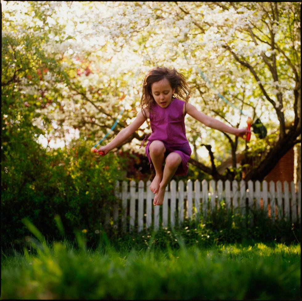 Bryan Wolf Portrait Photograph - Lyla Jumping