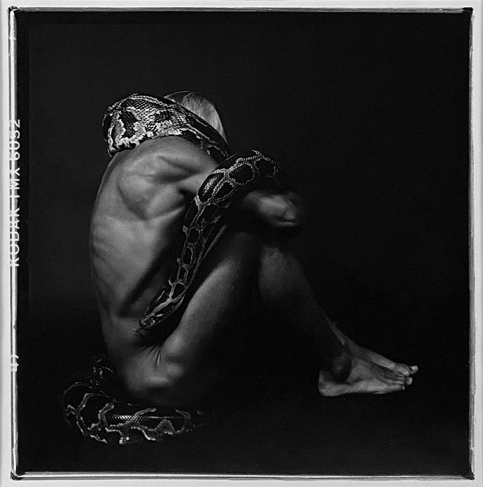 Chuck Pearson Black and White Photograph - Man with Snake