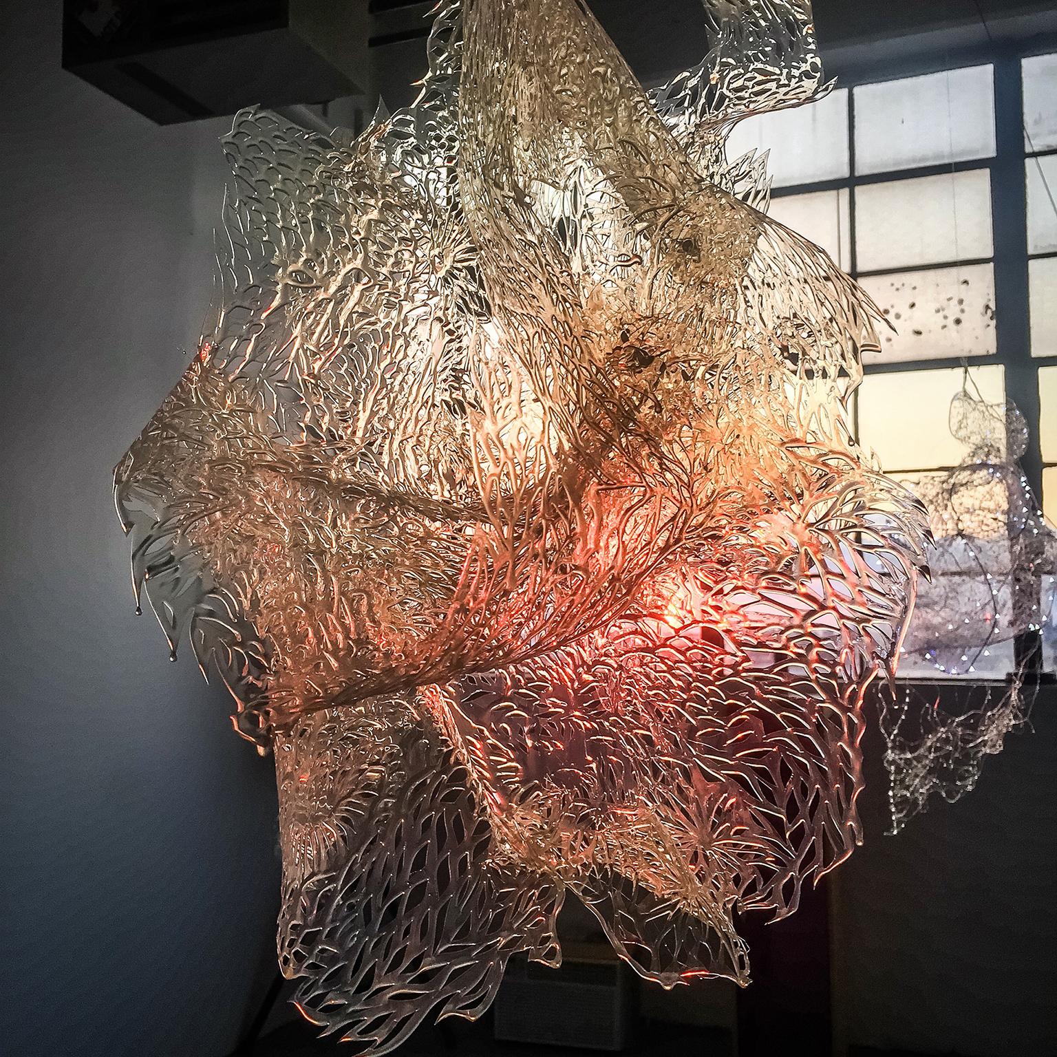 Medium: hand cut plastic, pigment, dichroic, resin, LED lights

Julia Sinelnikova is an interdisciplinary artist who works with holograms, performance, and digital culture. Her light installations have been exhibited internationally, and she has