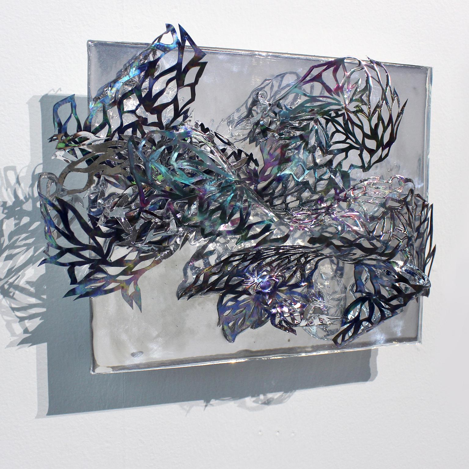 Medium: hand cut mylar, acetate, resin, acrylic

Julia Sinelnikova is an interdisciplinary artist who works with holograms, performance, and digital culture. Her light installations have been exhibited internationally, and she has performed widely