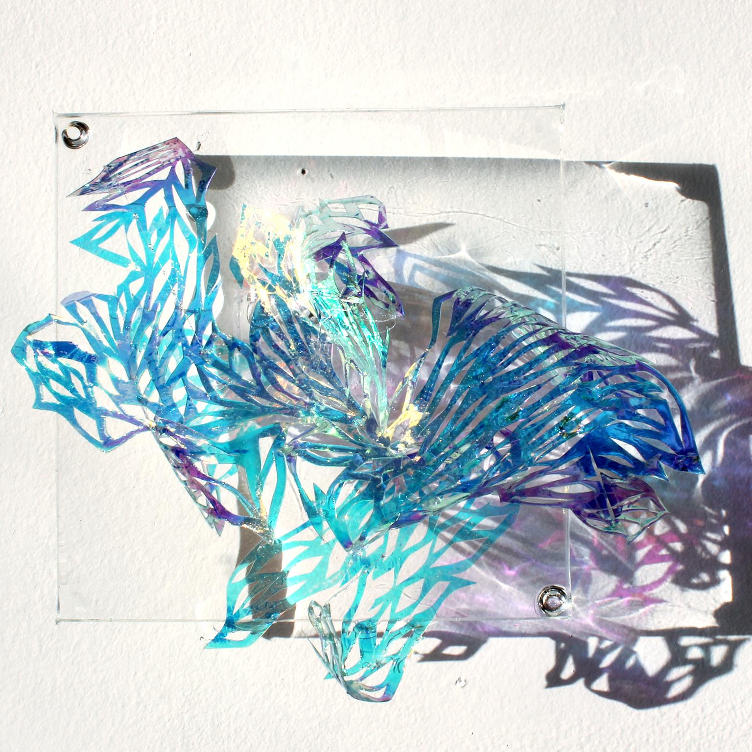 Medium: hand cut mylar, acetate, resin, acrylic  

Julia Sinelnikova is an interdisciplinary artist who works with holograms, performance, and digital culture. Her light installations have been exhibited internationally, and she has performed widely