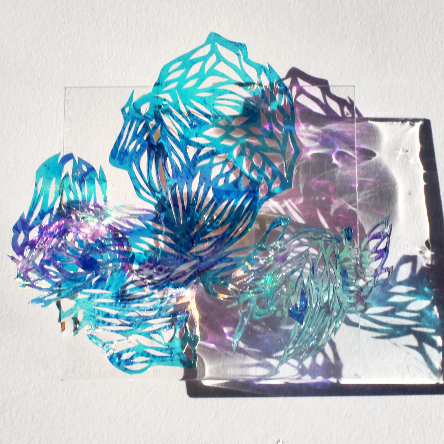 Medium: hand cut mylar, acetate, resin, acrylic  

Julia Sinelnikova is an interdisciplinary artist who works with holograms, performance, and digital culture. Her light installations have been exhibited internationally, and she has performed widely