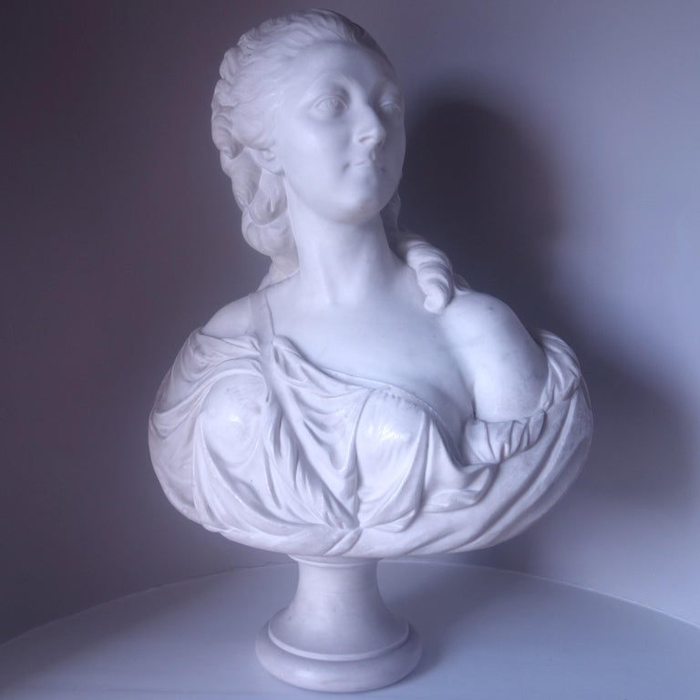 A 19th century white marble bust of  Marie-Jeanne Bécu, the Comtesse du Barry after the 18th century original by the French sculptor Augustin Pajou. Madame du Barry was the favourite mistress of France's King Louis XV, and was also a major patron of