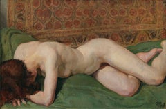 Nude of a woman. Sensual portrait of a girl on a bed with colored tapestries