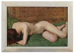 Nude of a woman. Sensual portrait of a girl on a bed with colored tapestries