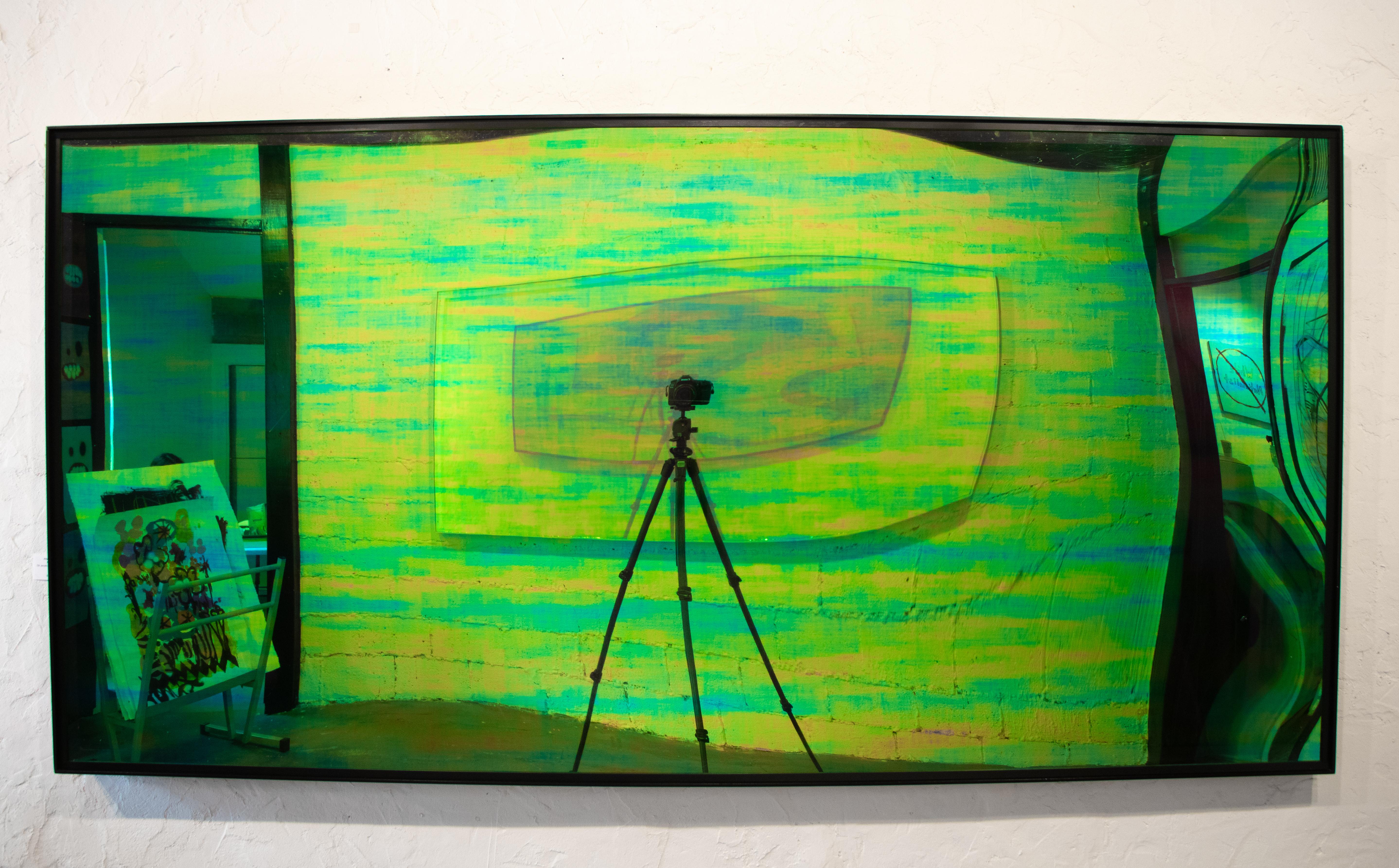 In this piece, Marcus Manganni has mounted a large sheet of cast acrylic covered with an emerald polychromic vinyl in an aluminum frame,  which stares back at viewers as they see themselves in the reflection. 

This piece can also be hung vertically