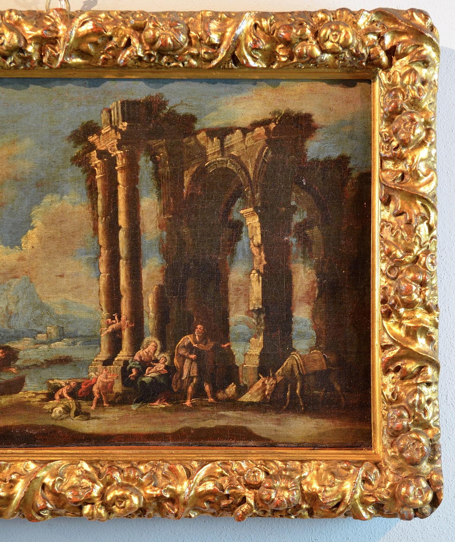 Nicola Viso
(attivo a Napoli nella prima metà del XVIII secolo)
Capriccio architettonico con tempio in rovina e scena del resto della Sacra Famiglia

Scuola napoletana del XVIII secolo
olio su tela, 38 x 64 cm
Con una preziosa cornice d'epoca cm. 50