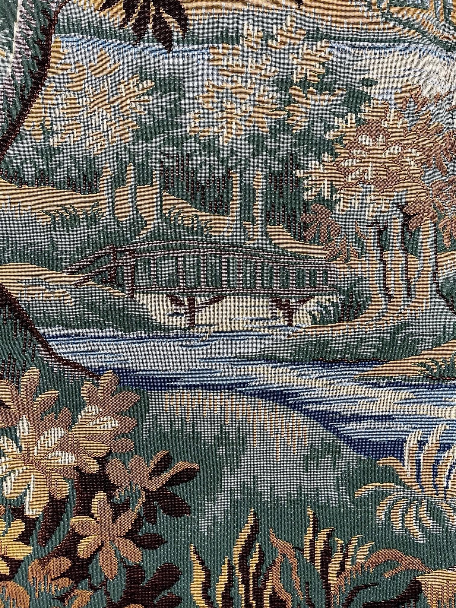 In the 17th Century, landscapes with trees, birds and rivers were popular, and often included architectural features.  Plants and flowers of the time are represented.
This tapestry is French made,  Jacquard woven with relief stitch. It is fully