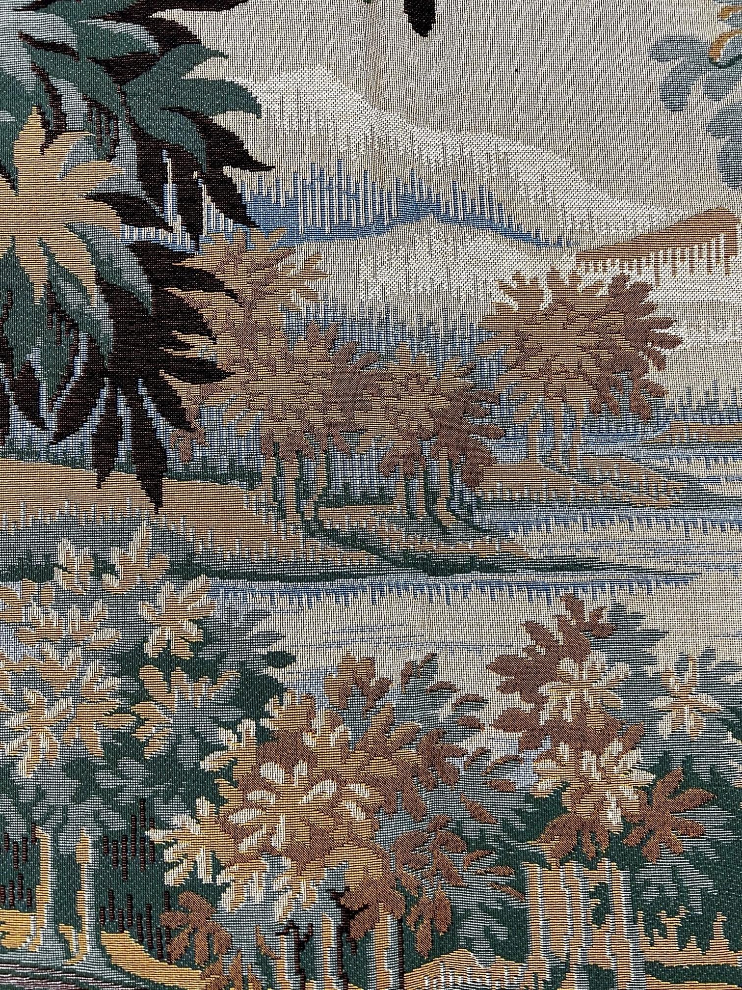 In the 17th Century, landscapes with trees, birds and rivers were popular, and often included architectural features.  Plants and flowers of the time are represented. This tapestry is French made,  Jacquard woven with relief stitch. It is fully