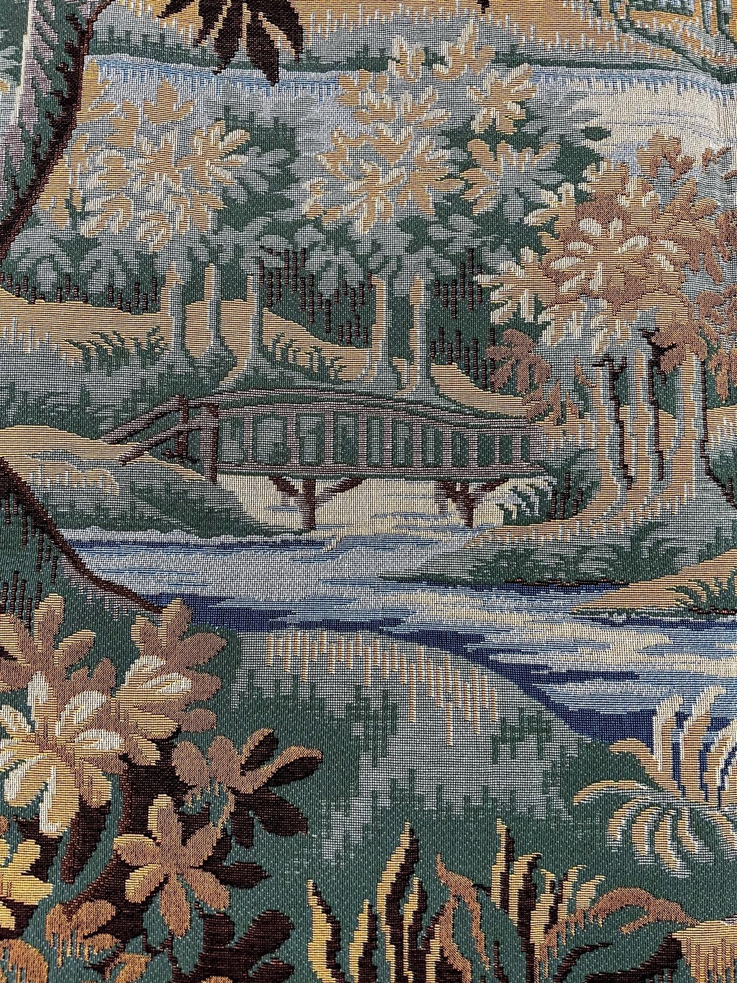 In the 17th Century, landscapes with trees, birds and rivers were popular, and often included architectural features.  Plants and flowers of the time are represented. This tapestry is French made,  Jacquard woven with relief stitch. It is fully