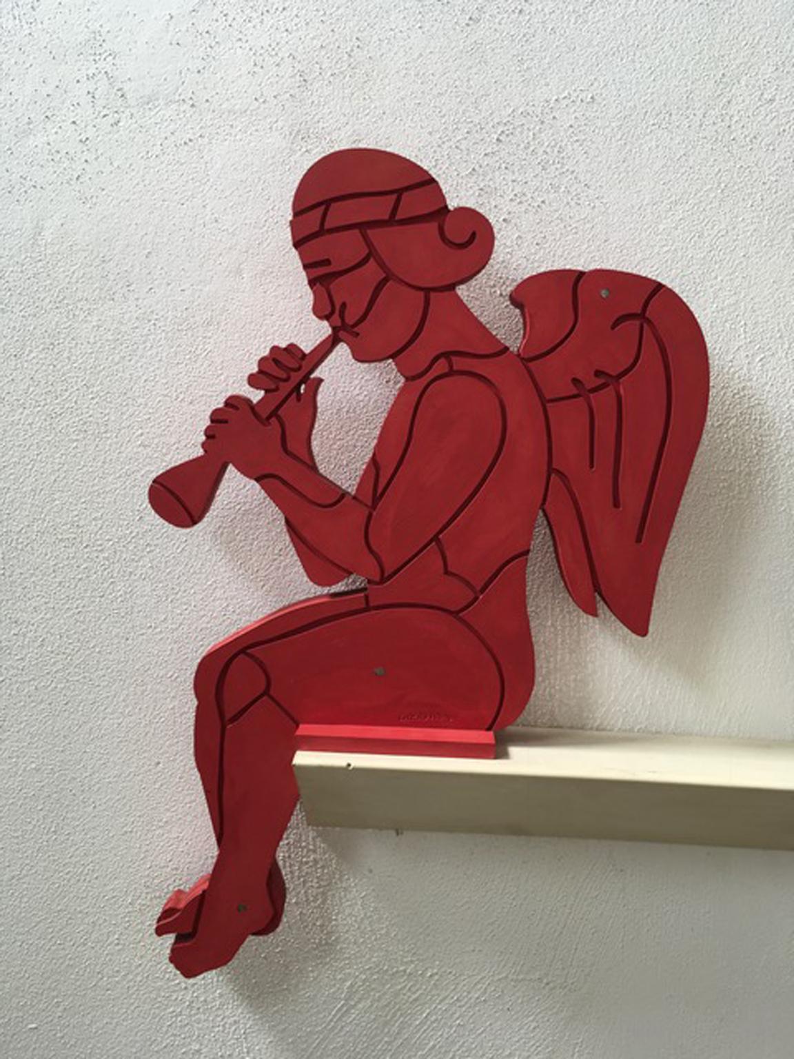 This amazing wall sculpture is an abstract figure in a vibrant hand lacquered red color.
A graphic drawing on the wall like a Pop Art artwork.

Bruno Chersicla Italian artist well known in the Northern part of Italy for these colored wood