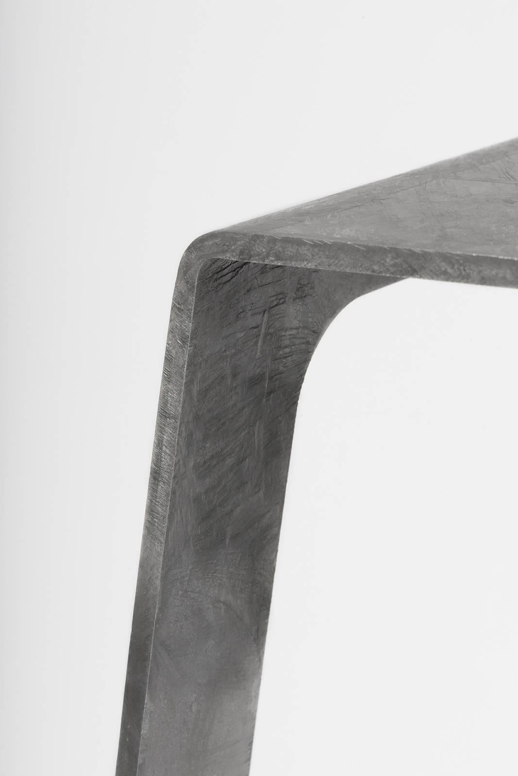 A_Stool bar height stool in hot-dipped galvanized steel. A minimal, backless design in steel with a durable coating of zinc. Also available in brushed, sanded, or polished finish. Signed, dated and numbered to the underside with a laser-etched