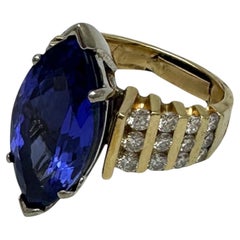 AAA 8ct Marquise Tanzanite & 1.00ct Channel Diamond Solitaire Ring