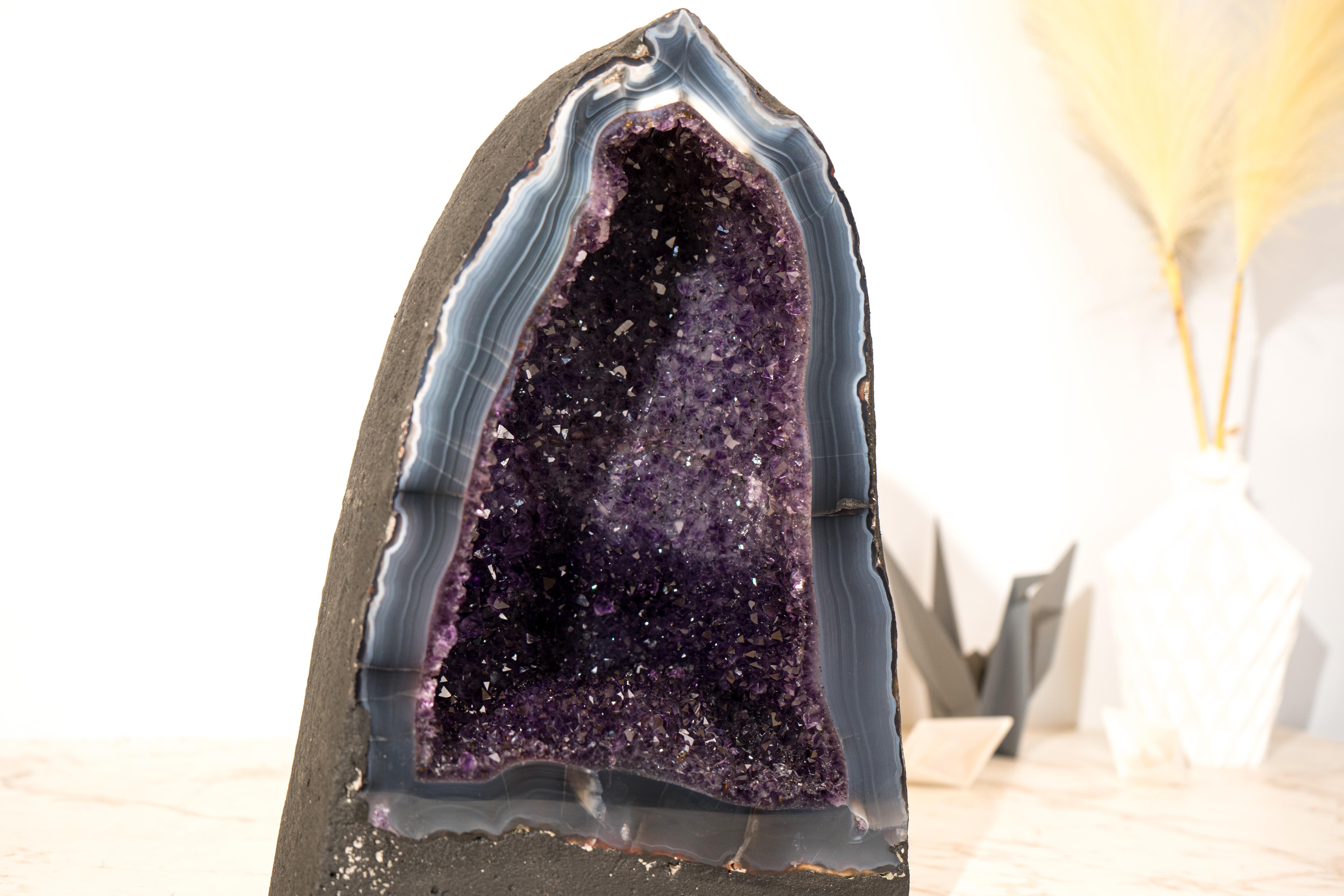 A Natural Masterpiece: Gorgeous Amethyst on Blue Lace Agate Geode

▫️ Description

Gorgeous at first sight, this geode, composed of Amethyst on a Lace Agate matrix, showcases a rare and harmonious combination of colors, aesthetics, and pristine