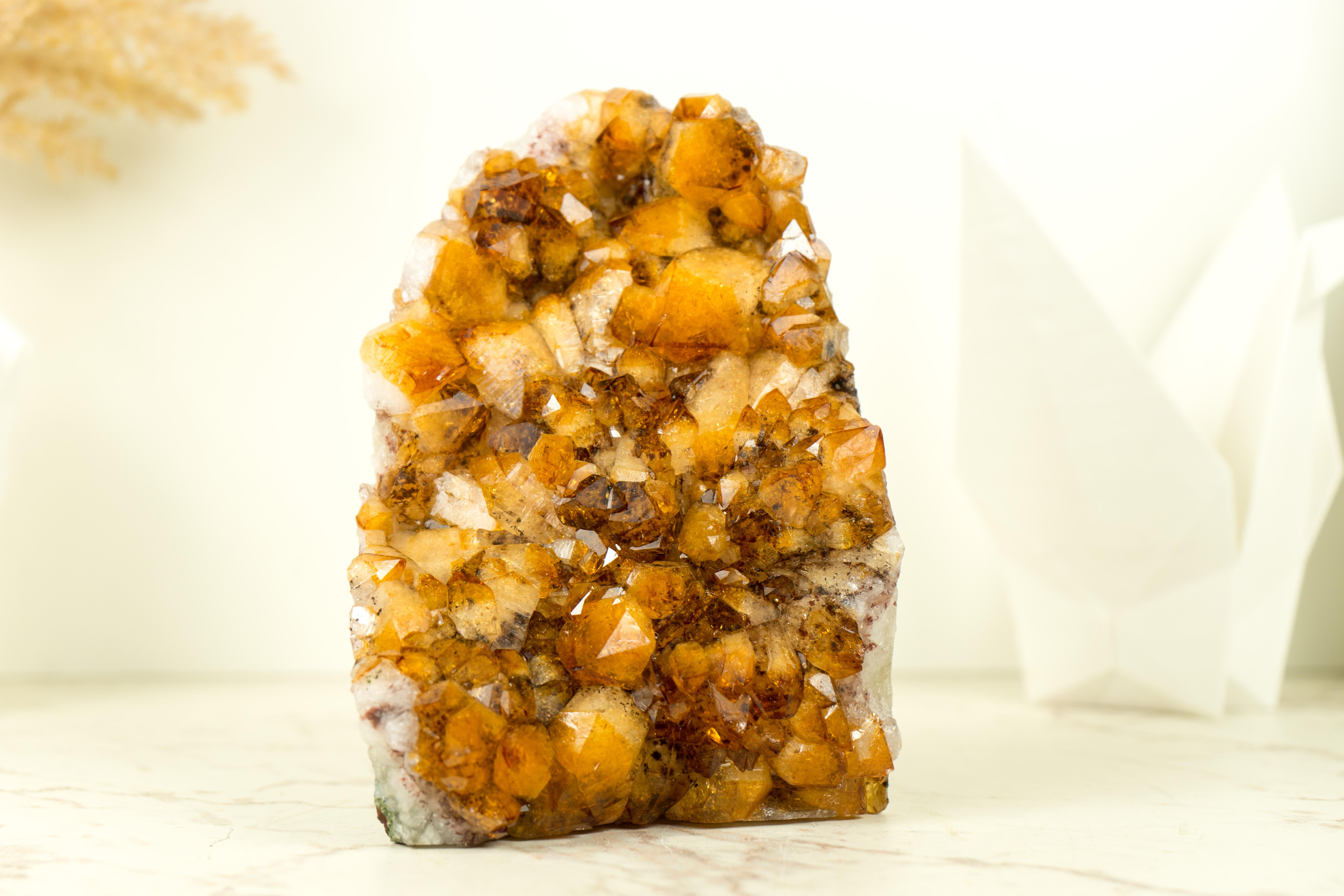 A Small & Rare Citrine Cluster that boasts world-class color tones, beautiful aesthetics, and unique characteristics. This extraordinary citrine crystal promises to be a stunning addition to your office table, home decor, or crystal collection, with