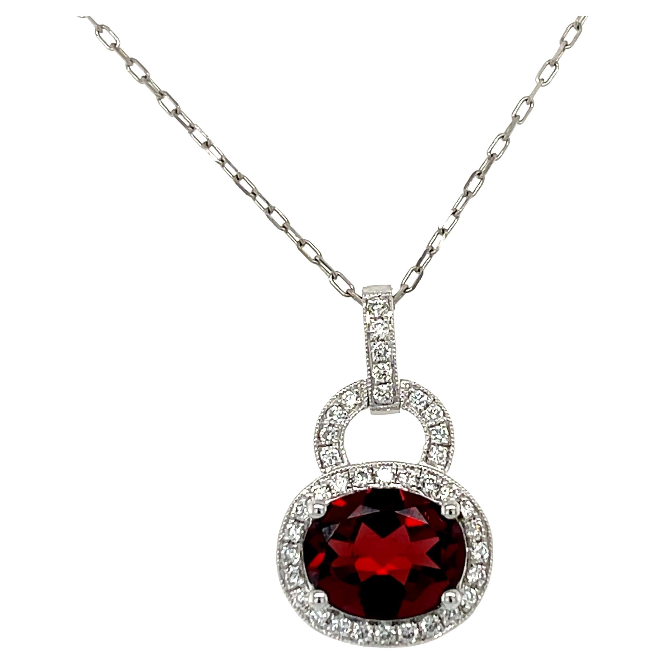 AAA Oval Garnet and Diamond Halo Pendant in 14KW Gold For Sale