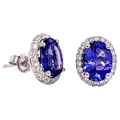 Clous d'oreilles AAA en or blanc 14 carats avec tanzanite ovale et diamants