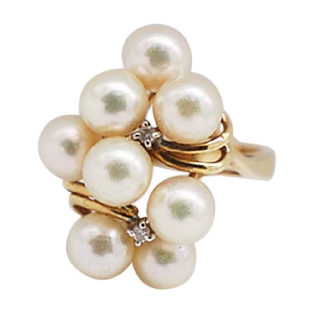 Quality, AAA Pearl Cluster with Diamond set in beautiful 14 Karat gold ring
Matched 5.5 mm luxurious cultured pearls set in a cluster with diamond accents. 
The quality of diamonds is SI1-VS2 clarity and H color.
 The ring size is 6.5. 
The weight