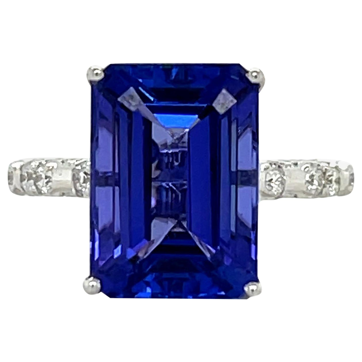Anillo de oro blanco de 18 quilates con tanzanita y diamantes talla esmeralda de calidad AAA