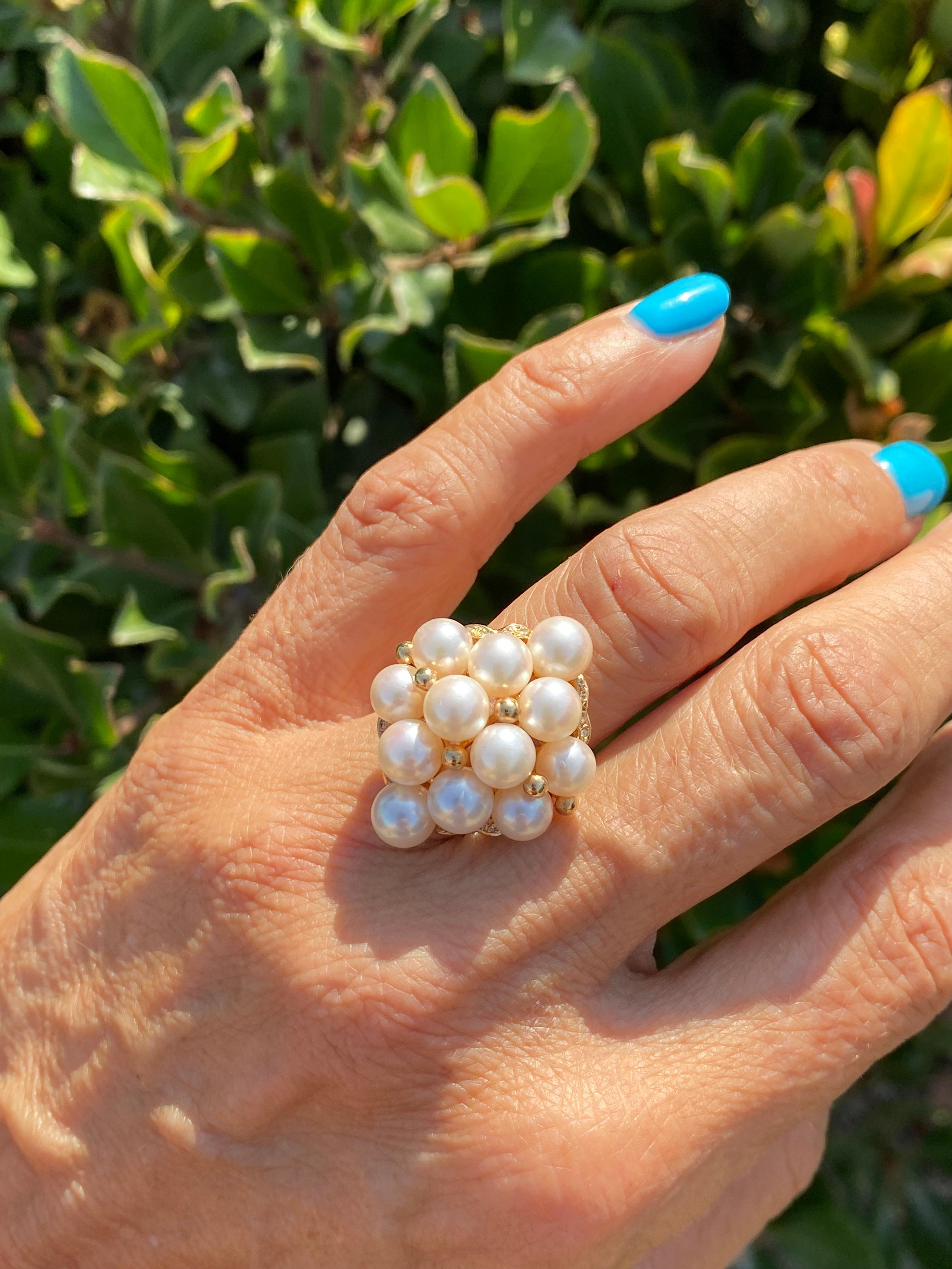 This quality pearl ring is lush with luster illuminating from matching, quality AAA pearls set with diamonds in a 14 karat. yellow gold setting

12 pristine pearls are set in a diamond shape ring with diamond accents at the four corners of the