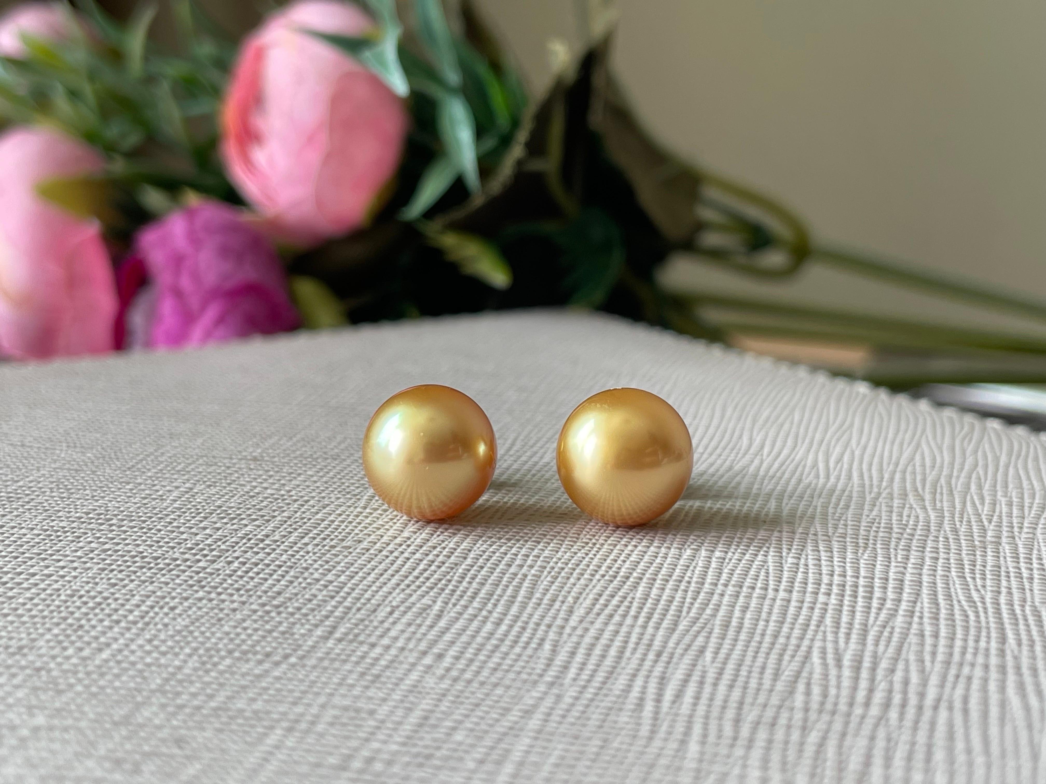 These stunning AAA quality 9.5mm Deep Gold South Sea Pearls boast a brilliant 24 Karat gold shade, an exceptionally rare find. They are fully round with a high luster, making them even more desirable. Securely mounted on solid 18-karat gold