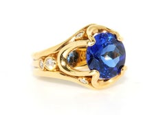 AAA Quality Very Fine Tanzanite in 18 Karat Yellow Gold with Diamonds Accents
