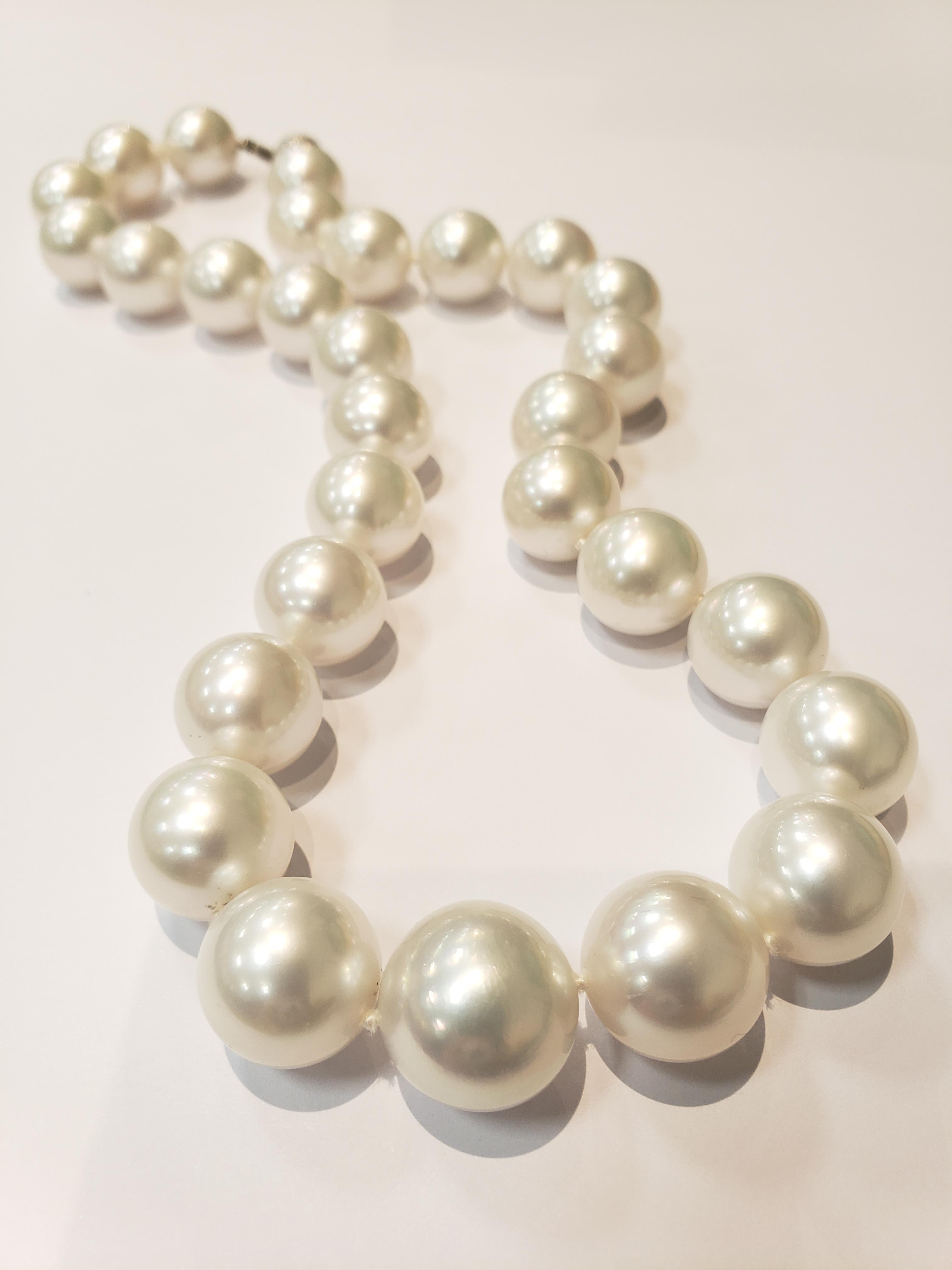 Strand of AAA quality white South Sea pearls graduated from 14.2 - 17 mm. Strand of 29 pearls, with a textured white gold ball clasp. Necklace is 18