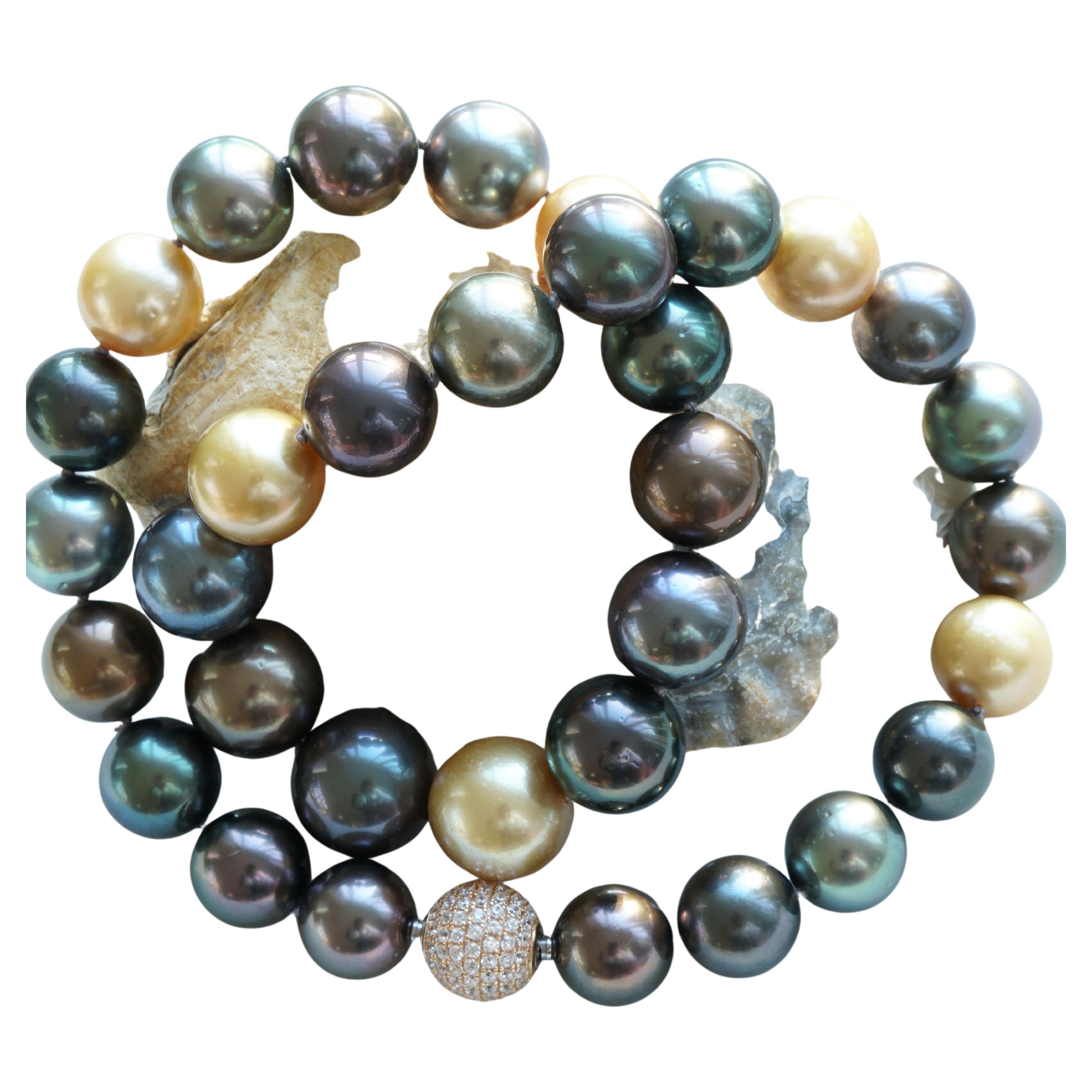 Top quality 33 round tahitian and southsea cultured pearl necklace in the most beautiful natural colors w.e.g. gold, mocha, grey, aubergine, pistachio, anthracite and with a very fine luster, pearls (AAA+-AAA) with few growth marks typical of