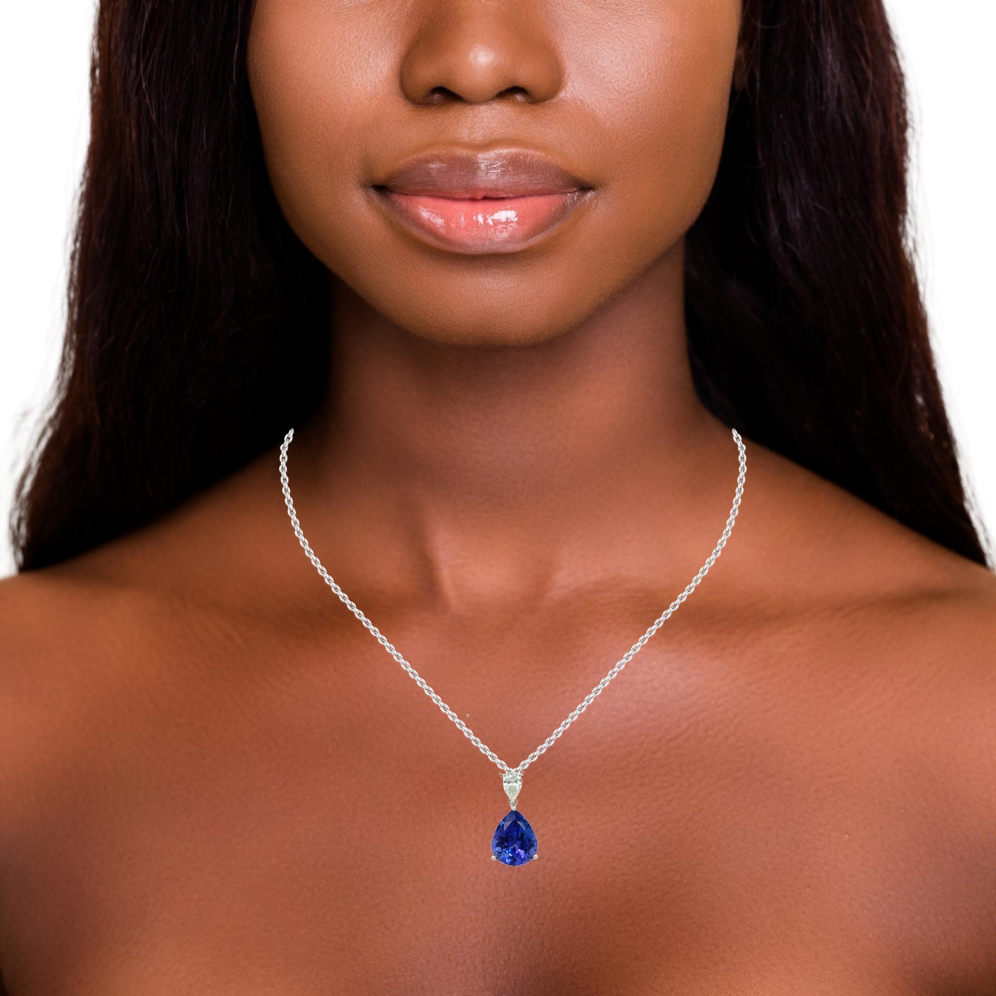 This stunning necklace has a deep colored 12x10mm pear shape AAA quality Tanzanite with a 0.46 ct pear shape top quality shimmering diamond.  Gold chain is included. Pendant is brand new with detailed tags attached. It comes in a beautiful box ready