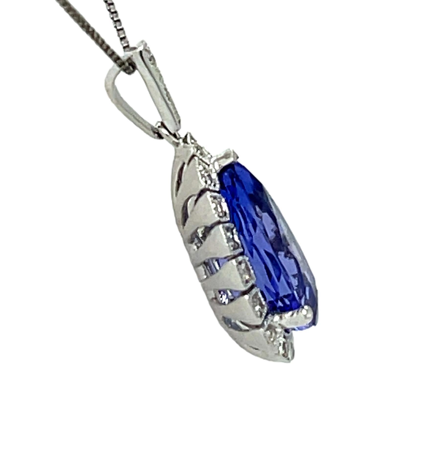 This stunning solitaire tear drop AAA quality Tanzanite pendant is surrounded by top quality shimmering brilliant cut diamonds. It comes in a beautiful box ready for the perfect gift! Gold chain included. 

18KW:          2.10 gms
Tanz wt:      3.81