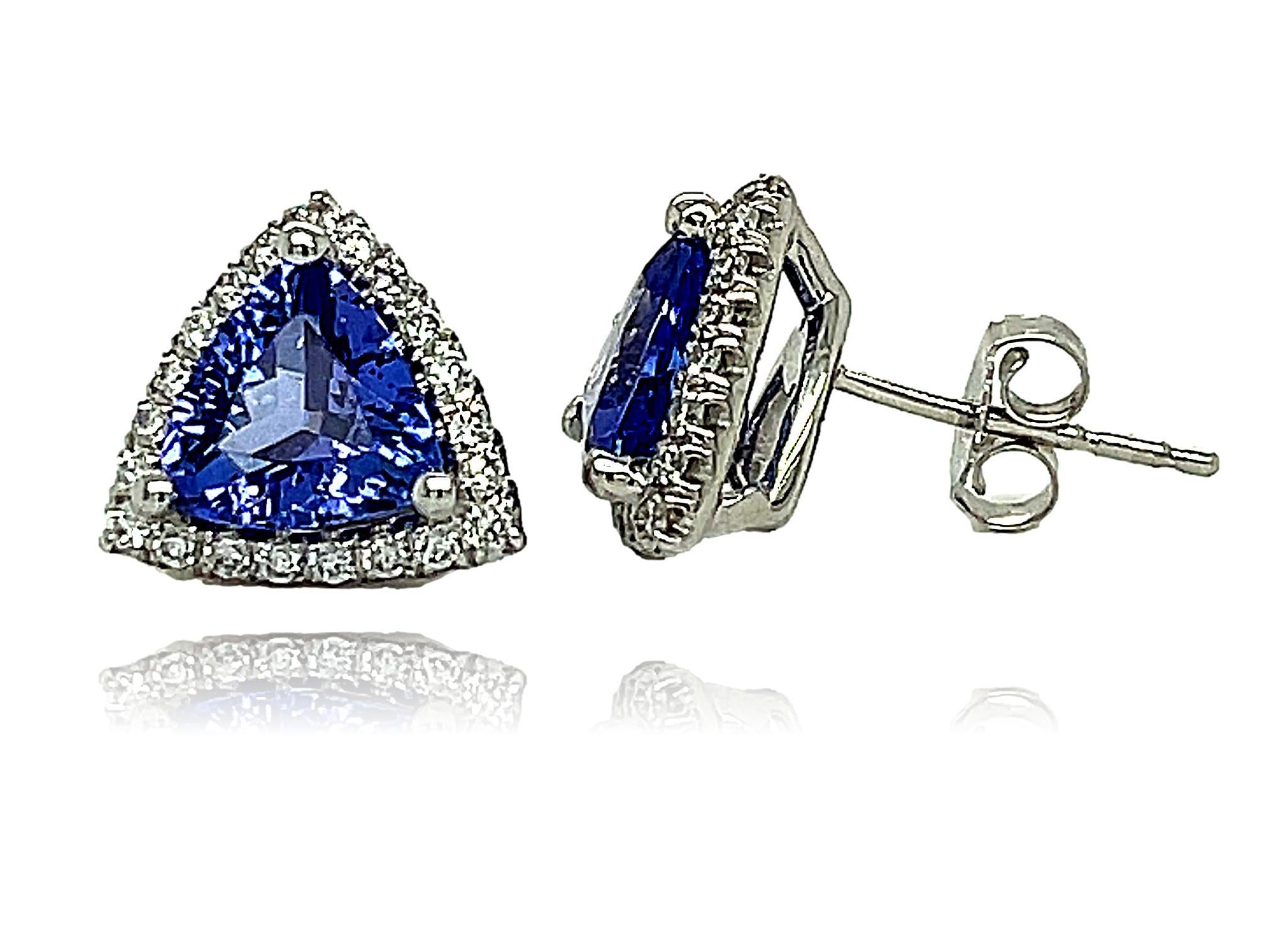 These stunning trillion AAA quality Tanzanite stud earrings are surrounded by shimmering diamonds. There is a double push lock for extra security. These earrings come in a beautiful box ready for the perfect gift!

14KW:            2.30 gms
Tanz