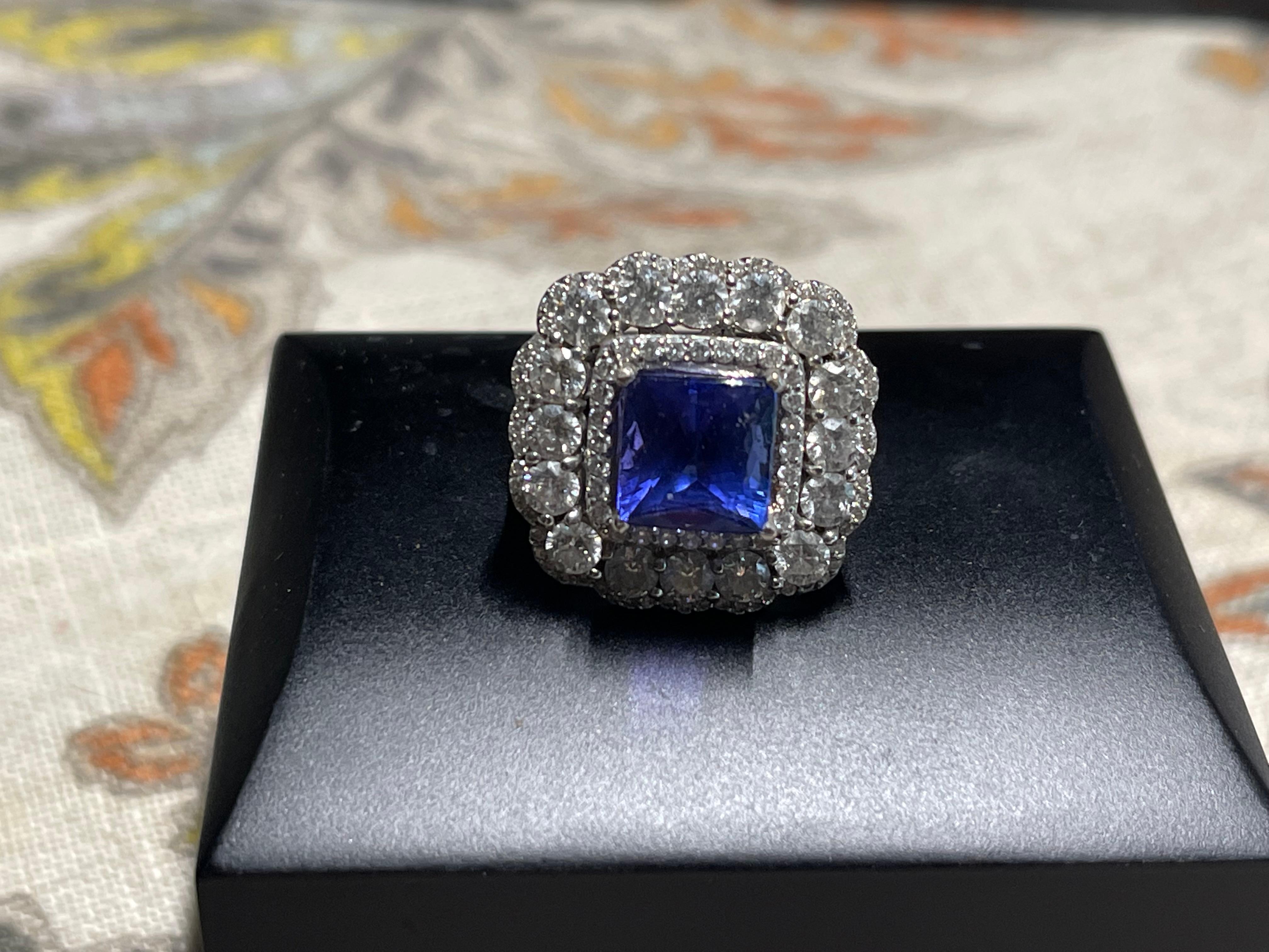 Stunning 5.92 CTW AAAA/Block D Tanzanite and 3.82 CTW full count round sparkling diamonds with G/H color and SI-11 clarity in 18k white gold.  A fabulous old school cocktail ring that will receive compliments every time you wear it.  What a stunning