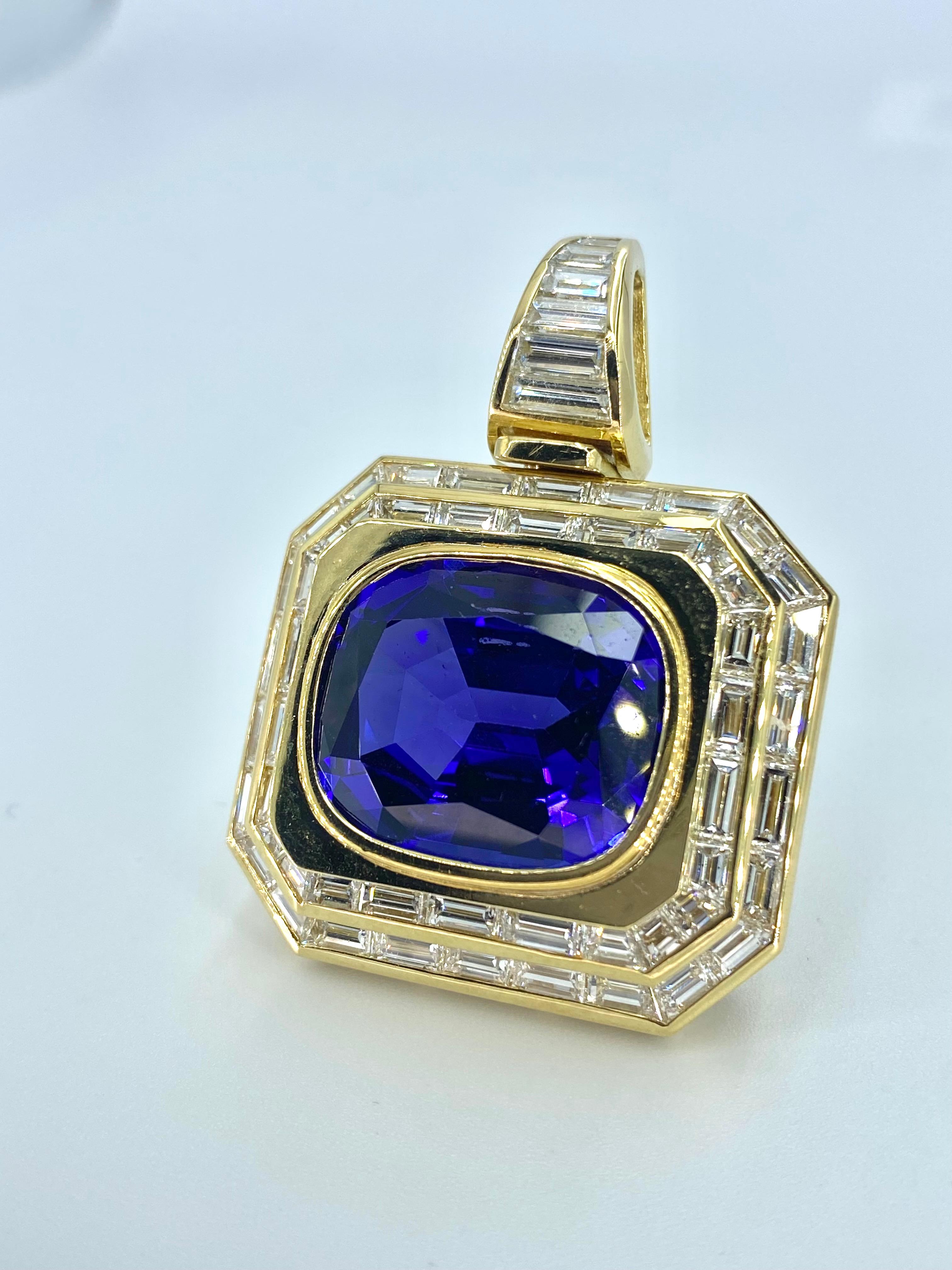A cushion-cut tanzanite and baguette-cut diamond pendant. This 25+ carat Tanzanite is of legendary status. With an 'AAAA' grading, it bears the highest quality grade possible for Tanzanite. Such a gorgeous color for a stone of this size is quite