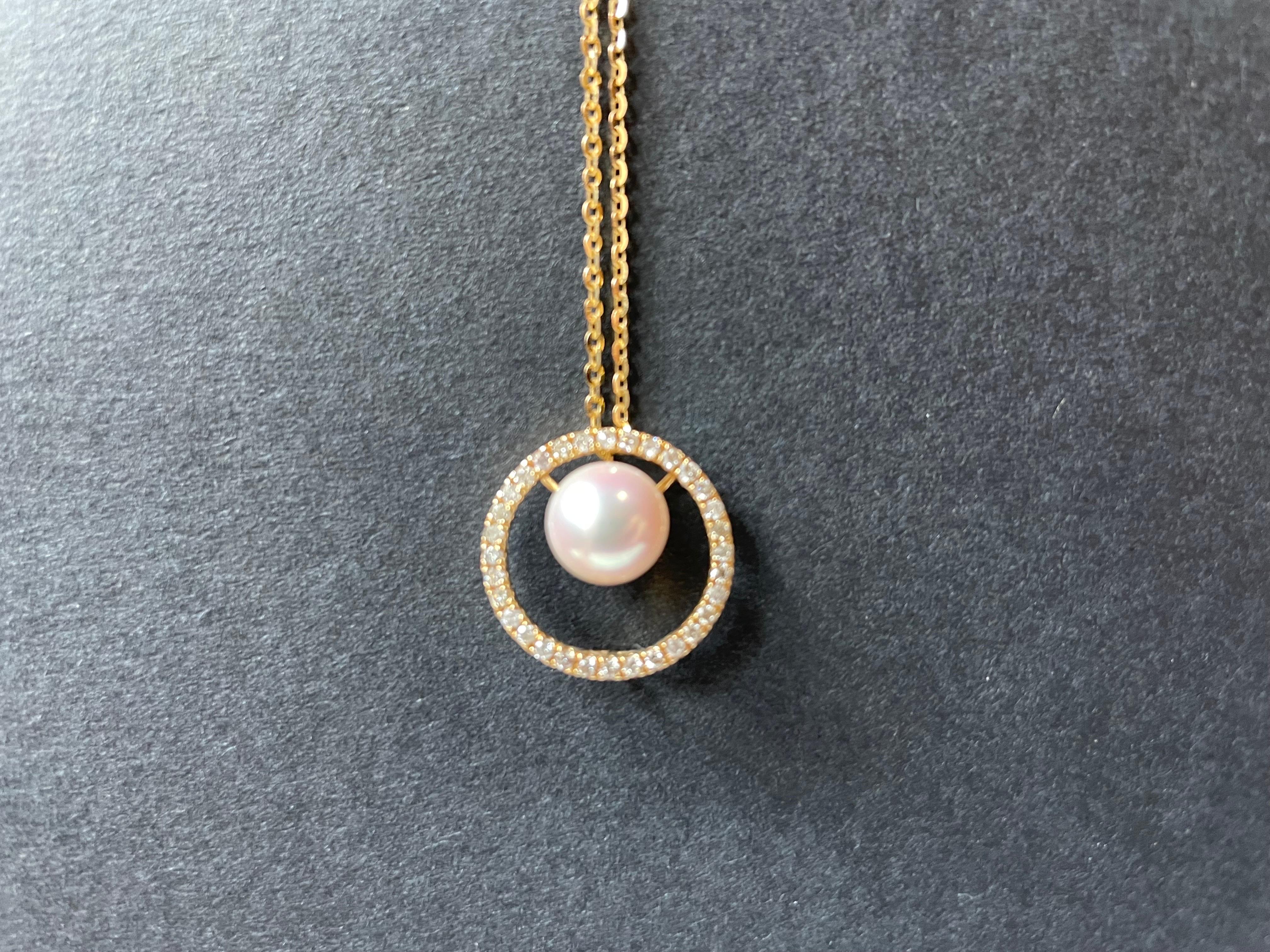 A simple and modern diamond pendant set with a natural Japanese Akoya delicately arranged in just the right place. The brilliant pearl is set in 18k gold and diamonds, offering a classic and timeless modern styling. The pendant can be worn in two