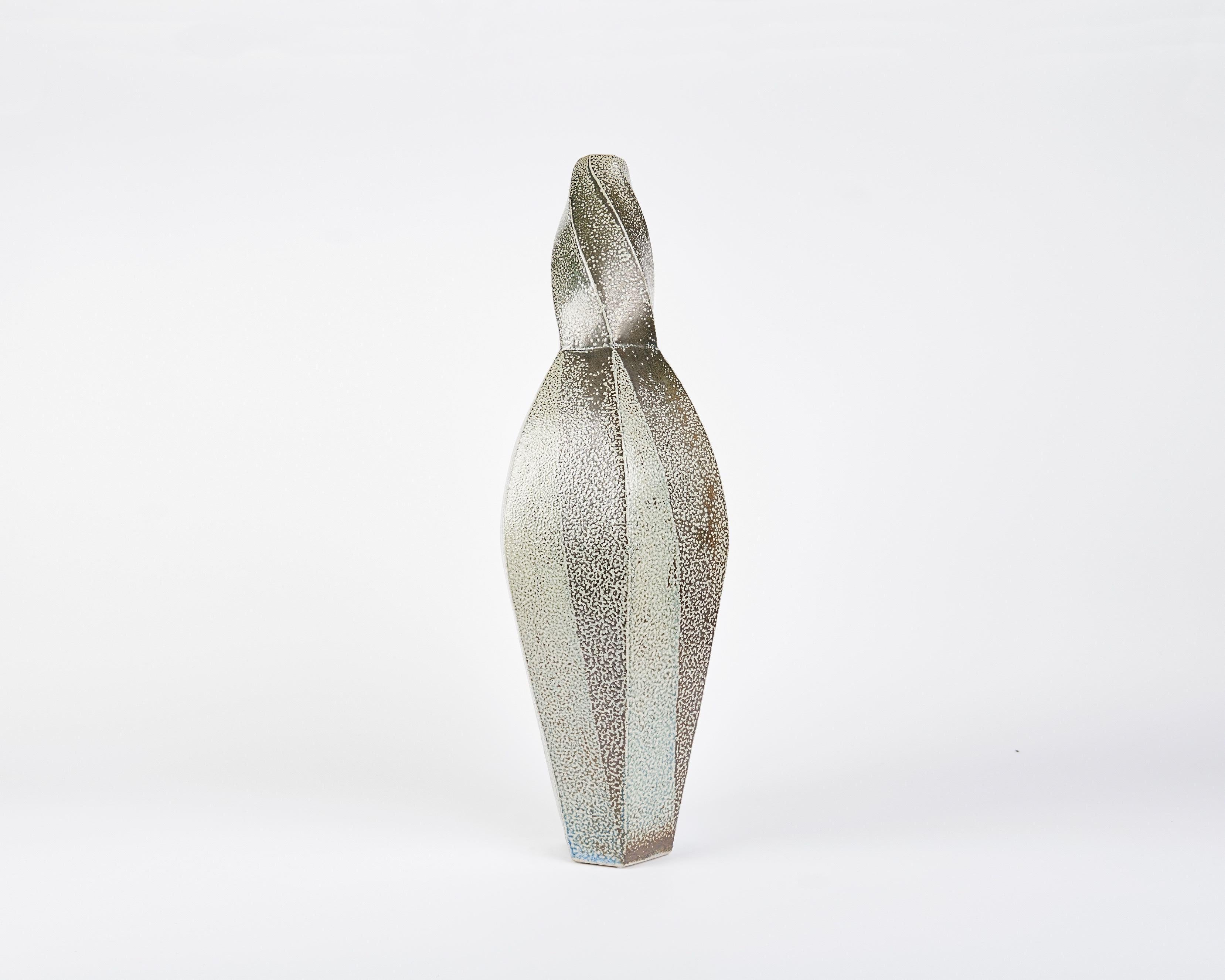 This twisted, faceted vase by contemporary Danish ceramicist Aage Birck, possesses a rigidity and texture unique for the medium.