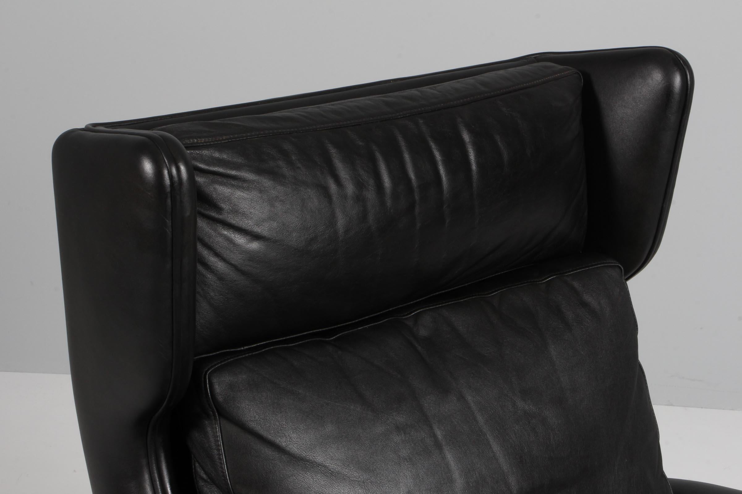 Danish Aage Christiansen for Esra Møbeler. Lounge chair in original black leather. For Sale
