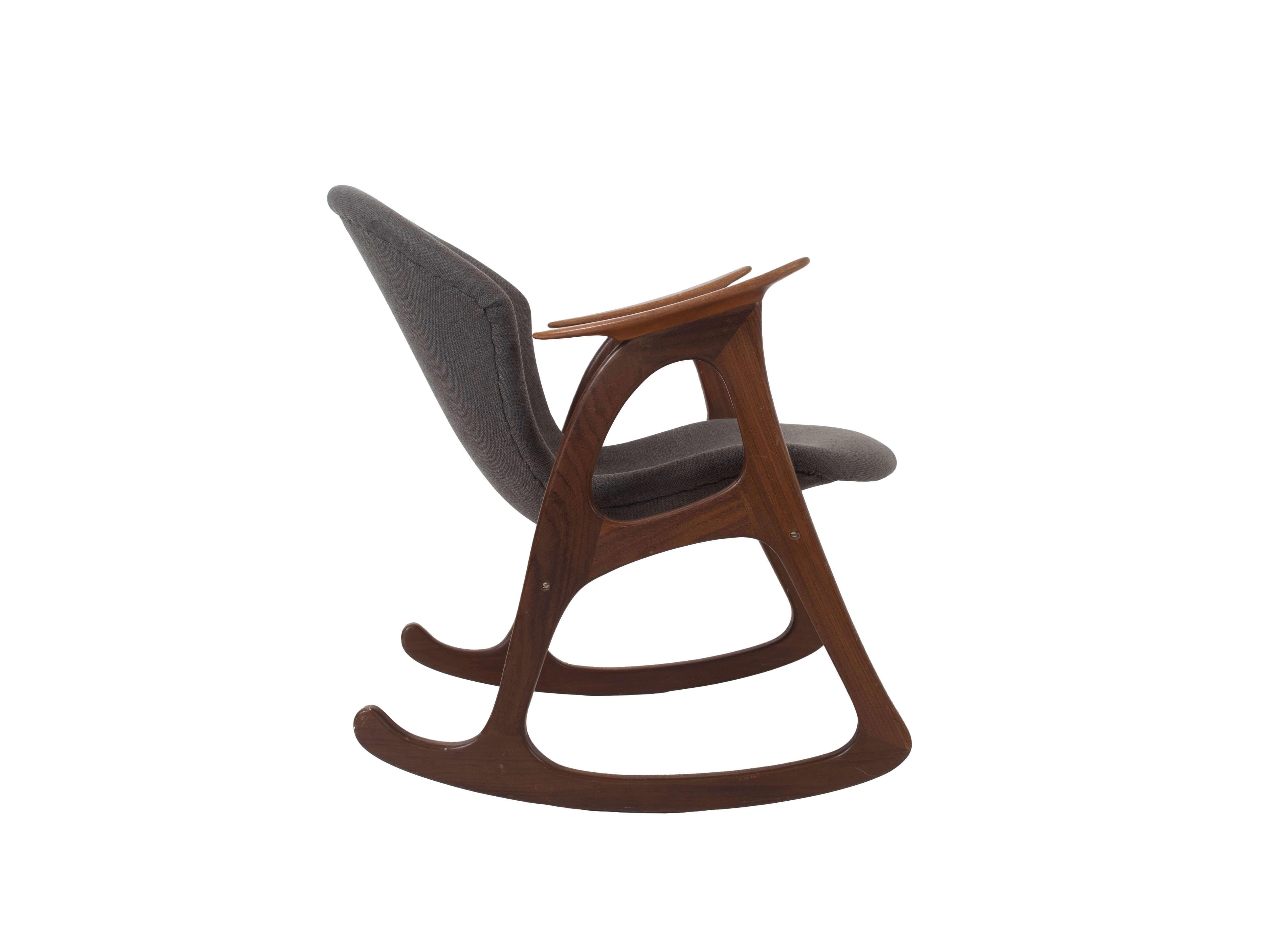Very decorative Danish vintage rocking chair by Aage Christiansen for Erhardsen & Andersen, Denmark 1960s. This chair is made of teak wood, which contrasts nicely with the fabric. It has the typical Scandinavian design features from the 1950s and