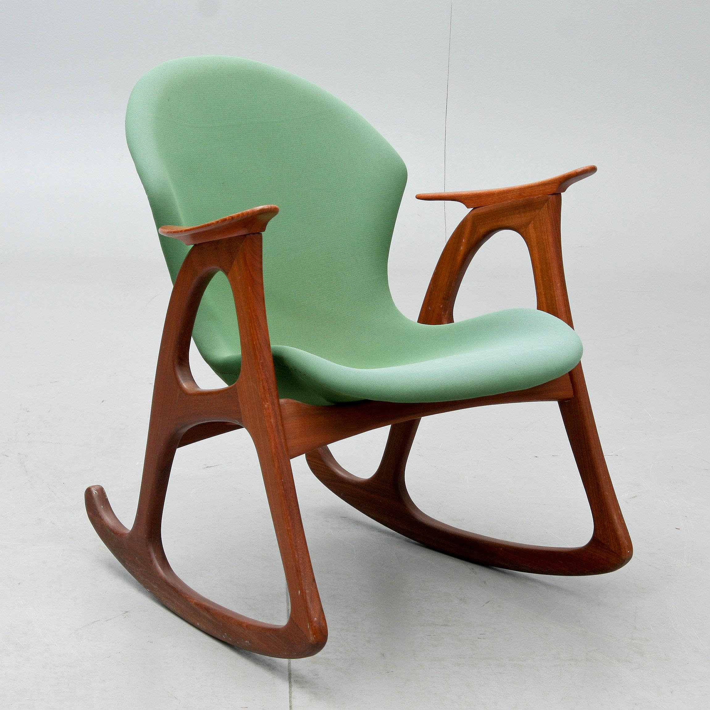 Aage Christiansen swivel chair. Erhardsen & Andersen Denmark 1960s
Teak wood Frame in good condition. Upholstered in its original green fabric
Good overall condition.

